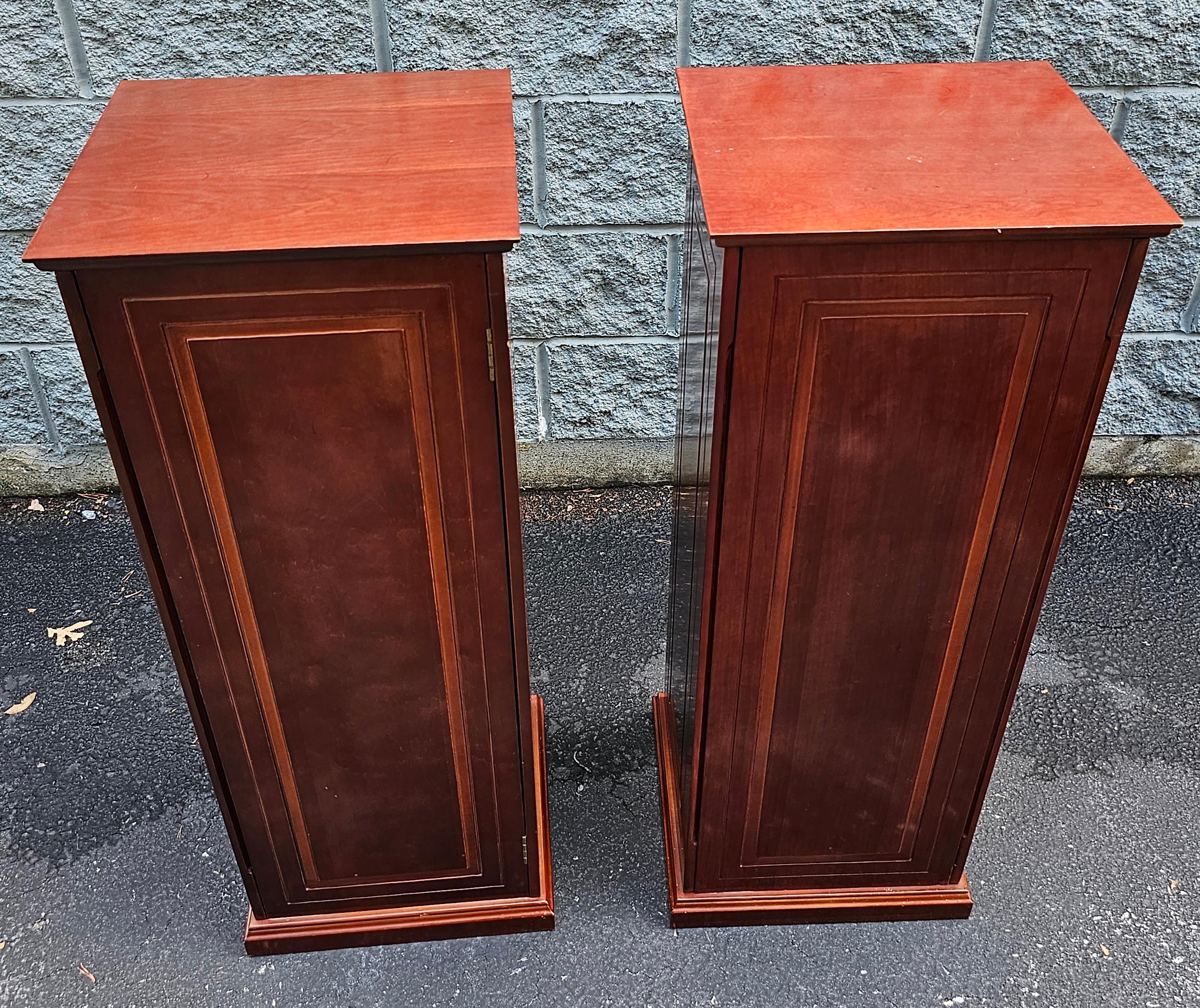 A pair of Late 20th Century Georgian Mahogany Pedestal / Column with double-door Cabinets. Use them for your statue, plant stands and use store CDs, DVDs etc...
Finished on all sides. Measure 37.1/4
