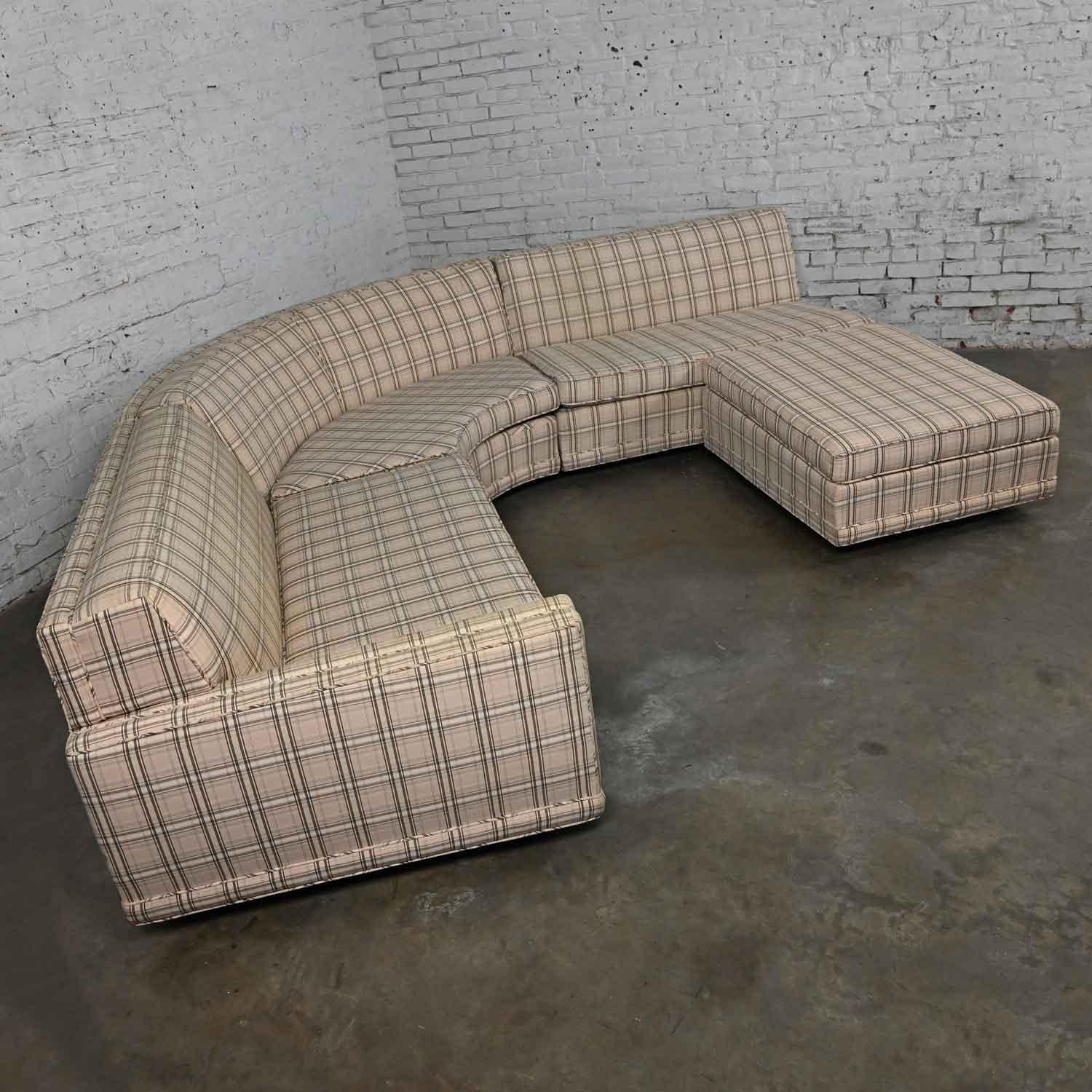 Lovely vintage Mid-Century Modern to modern plaid tuxedo curved sectional sofa with ottoman. Beautiful condition, keeping in mind that this is vintage and not new so will have signs of use and wear. The sofa has been professionally cleaned but there