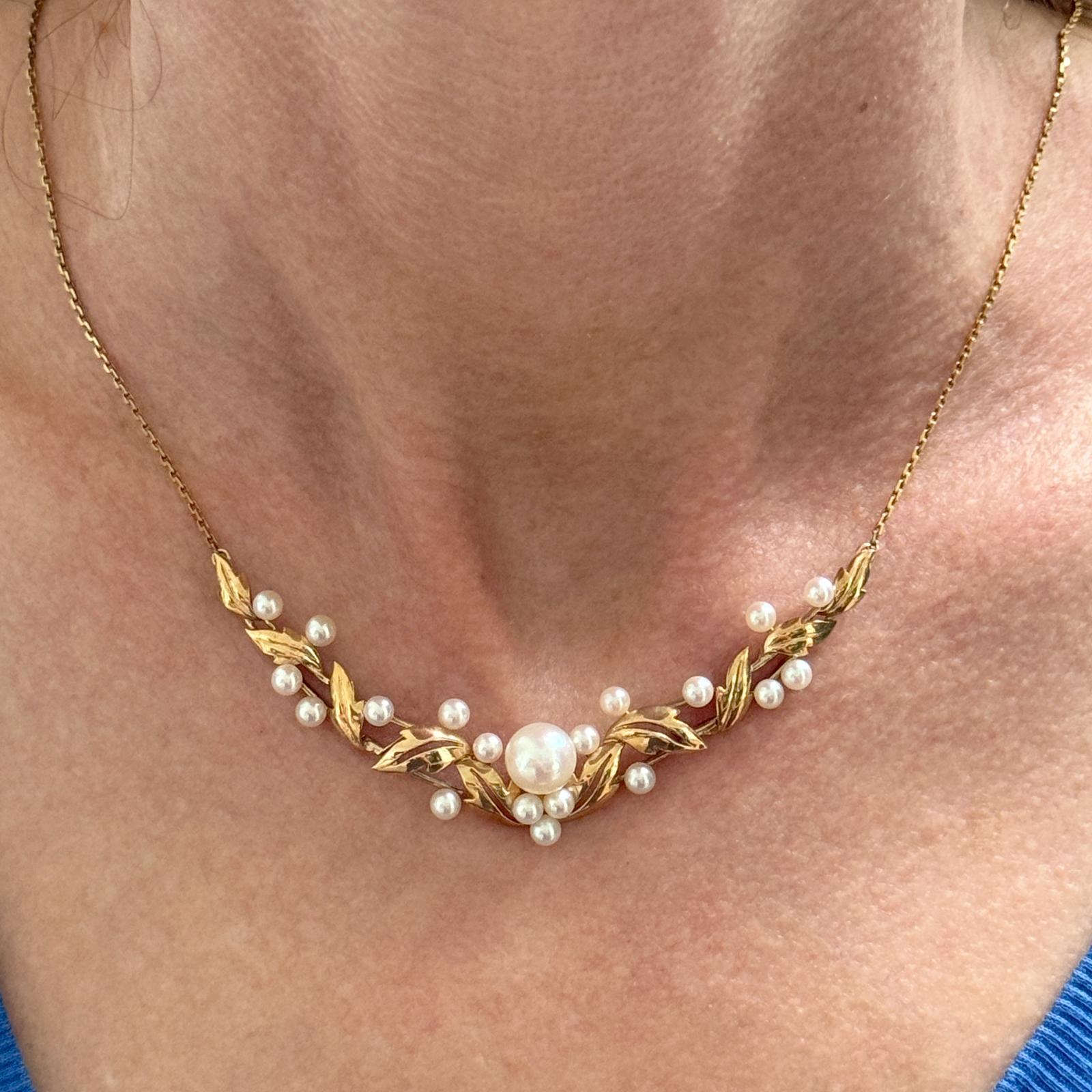 The Mikimoto Pearl 14 Karat Yellow Gold Vintage Link Necklace is a timeless piece that embodies classic elegance. Featuring lustrous, perfectly matched Mikimoto pearls measuring 3.5-8.5mm, this necklace is a V shaped hinged necklace creating a