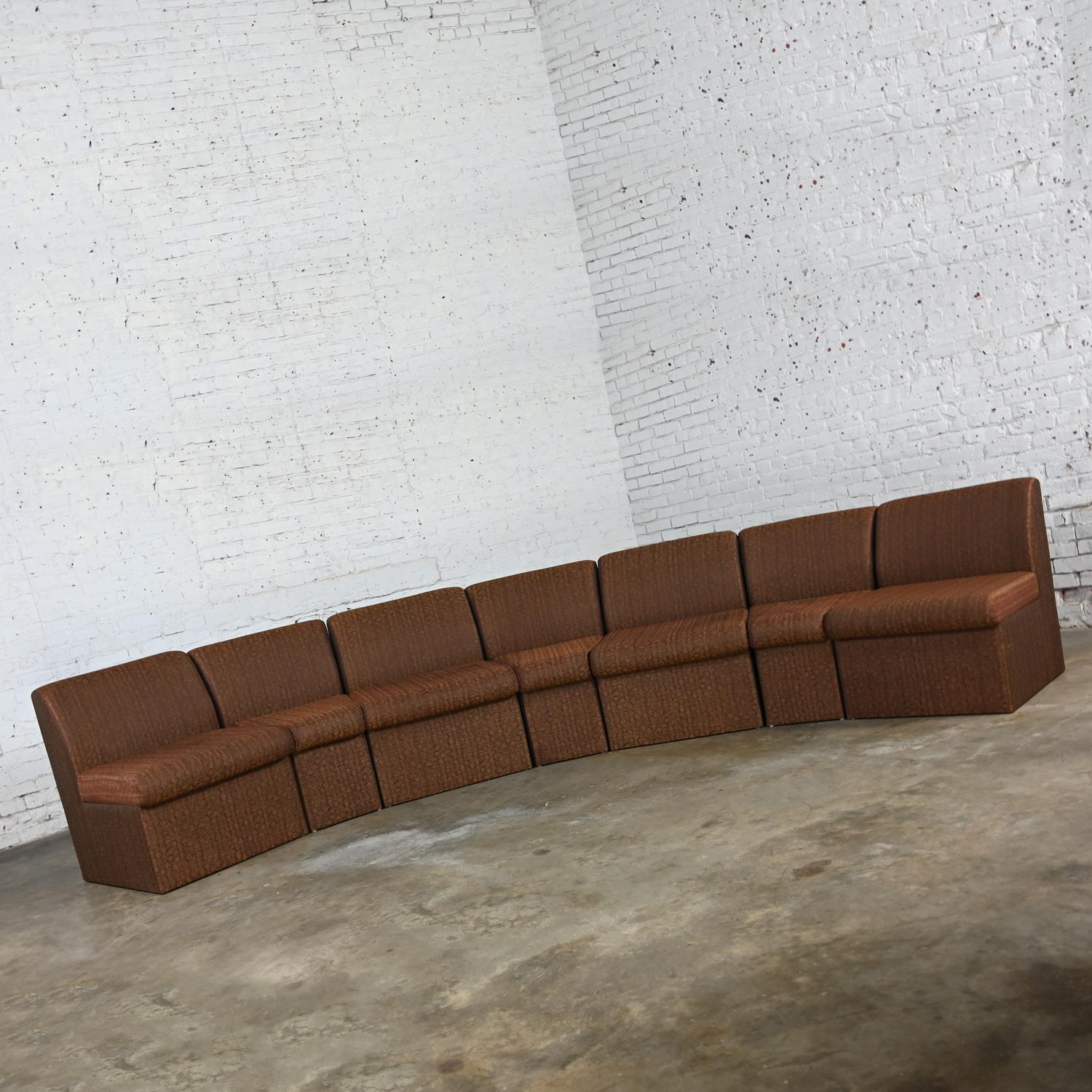 Fabulous vintage Modern Global Upholstery Company brown all upholstered seven-piece sectional sofa comprised of four straight pieces and three wedges. Beautiful condition, keeping in mind that this is vintage and not new so will have signs of use