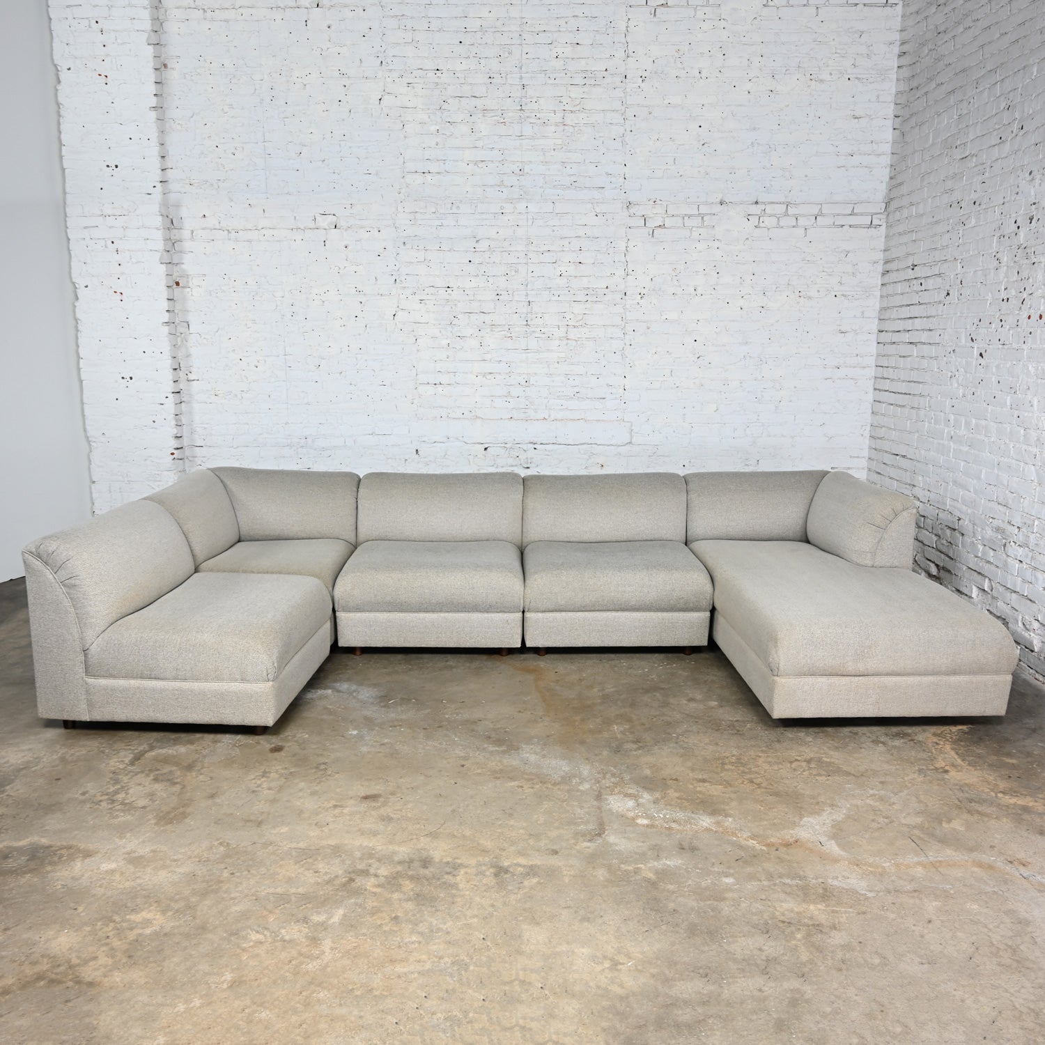 Wonderful Late 20th Century Modern modular sectional sofa 5 pieces with chaise and gray tweed like fabric. Comprised of 3 armless sections, a corner piece, and a chaise lounge with tight seat & back foam cushions and cylindrical wood legs with a