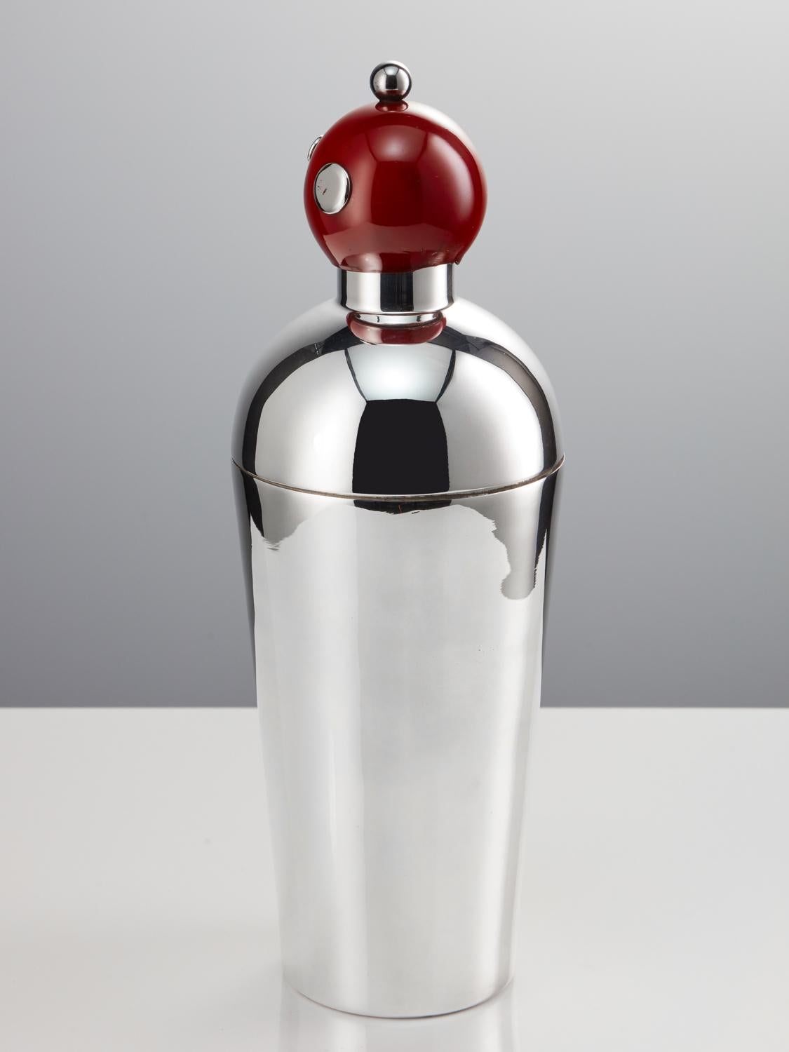 A great piece, late 20th century novelty cocktail shaker in the form of a Robot, with clown button features, Circa 1970.

Upon purchasing this item it was described as a Clown Robot, either way both expressions work well to describe the shaker.
The