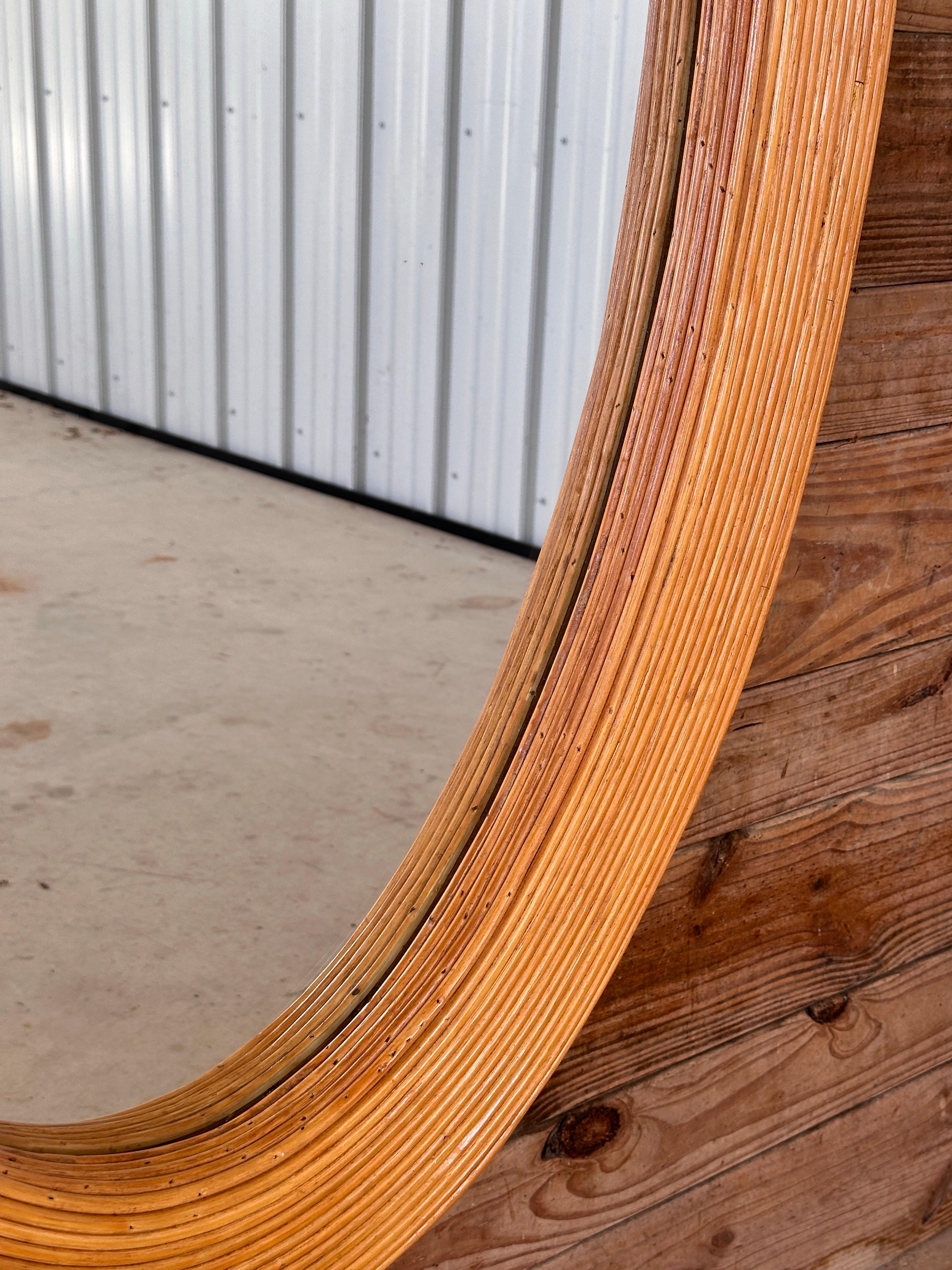Hand-Crafted Late 20th century Organic Modern Coastal Pencil Reed Rattan Oval wall Mirror For Sale