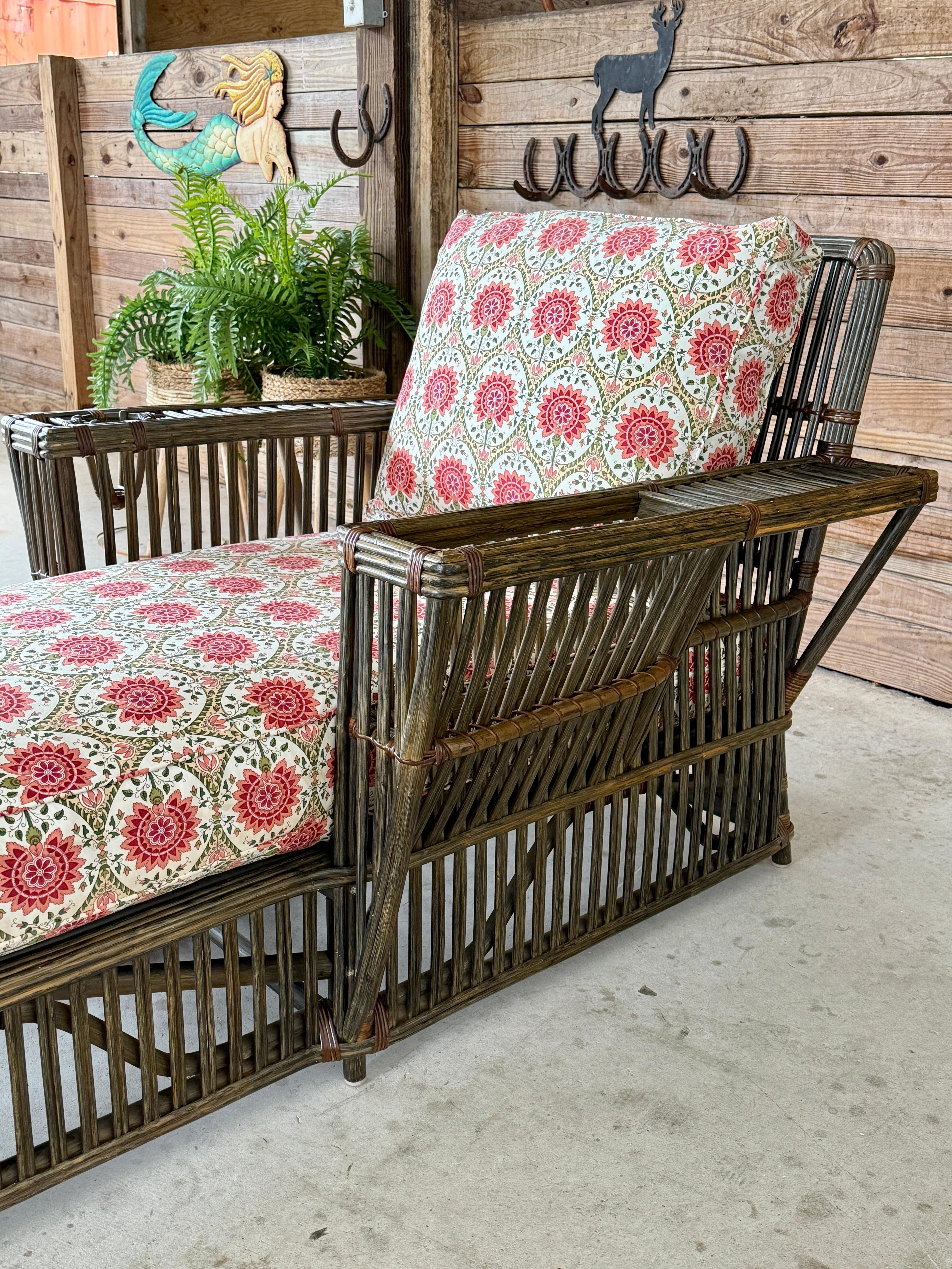 This exquisite stick rattan chaise lounge by Bielecky Brothers is a standout piece of late 20th-century design. Featuring its original vibrant floral upholstery, the lounge radiates vintage charm while offering exceptional comfort. The rattan frame