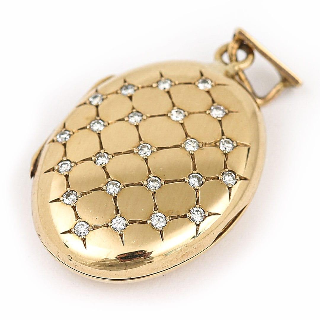 A delightful, contemporary solid yellow gold and diamond cross hatch pattern pattern with total of 23 round, brilliant cut diamonds with a total carat weight of 0.25ct. The oval locket with diamond set front opens to reveal to two panels which are
