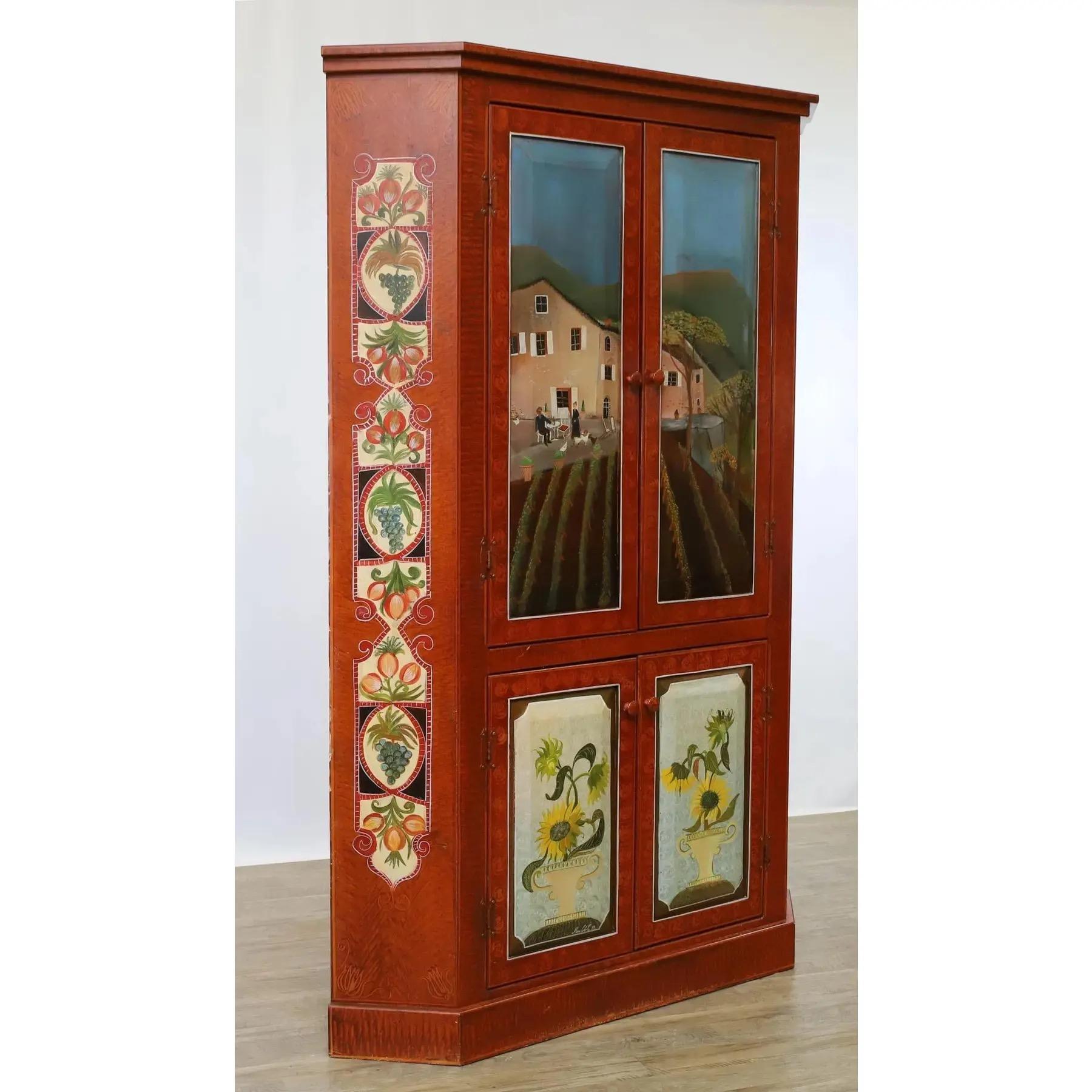 Hand-painted Marie Collette corner/media cupboard featuring decorative panels with figural landscapes, fruit and vine accents, and floral motifs. Crafted from pine beneath the paint, this cupboard includes two upper and two lower doors, each with