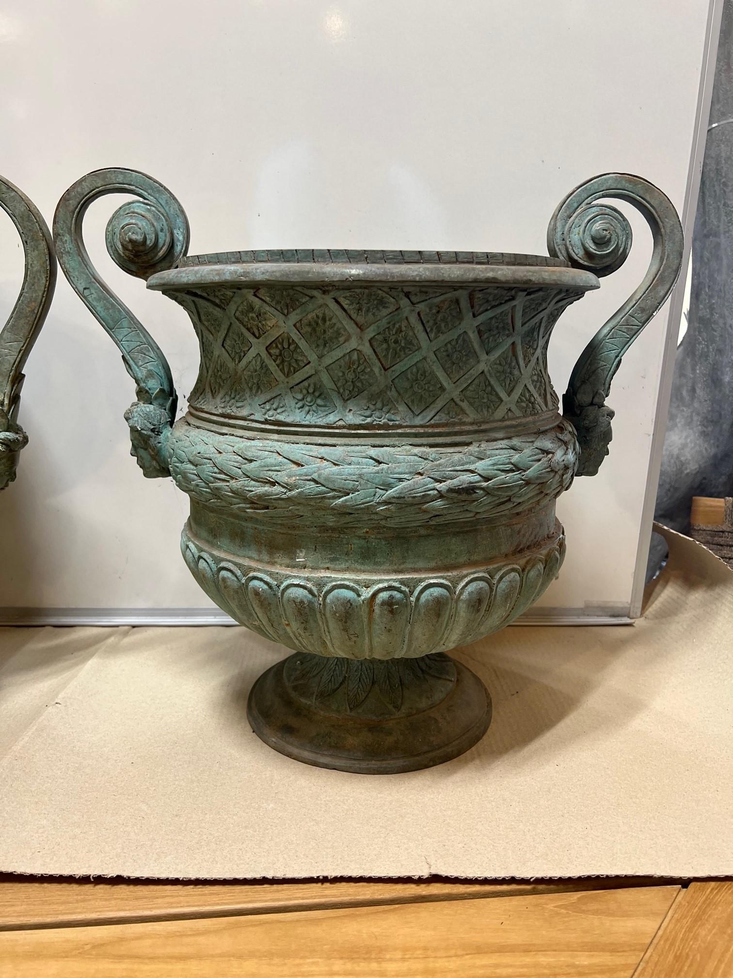 Cast Late 20th Century Pair of Bronze Urns with Handles and a Verde Patina