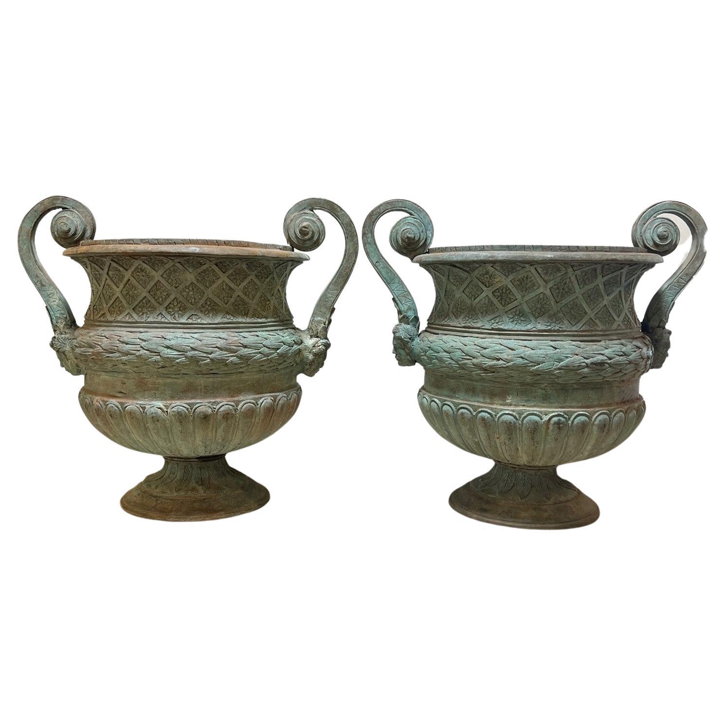 Late 20th Century Pair of Bronze Urns with Handles and a Verde Patina