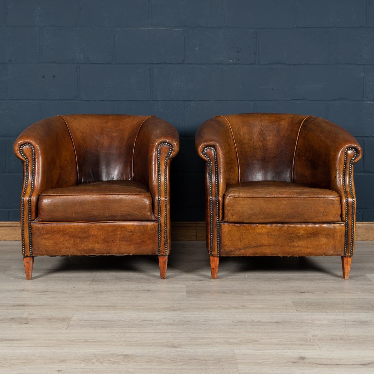 Showing superb patina and colour, this wonderful pair of club chairs were hand upholstered sheepskin leather in Holland by the finest craftsmen. Fantastic look for any interior, both modern and traditional.

Please note that our interior pieces