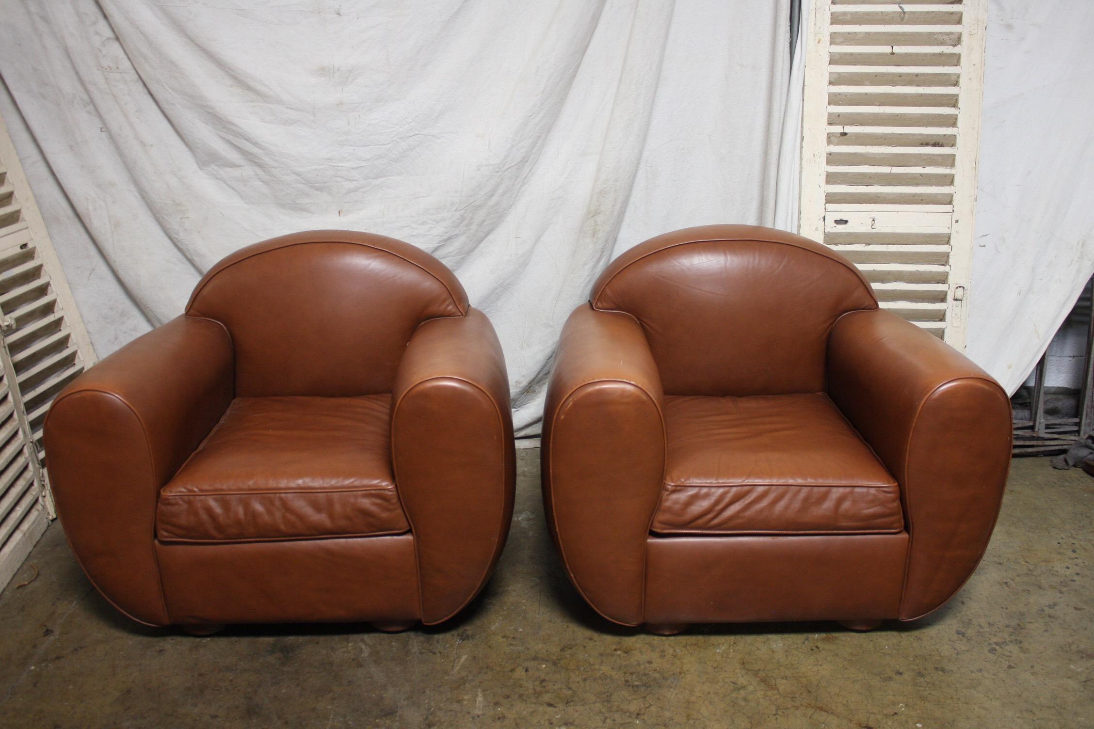 Late 20th century pair of French leather club chairs.