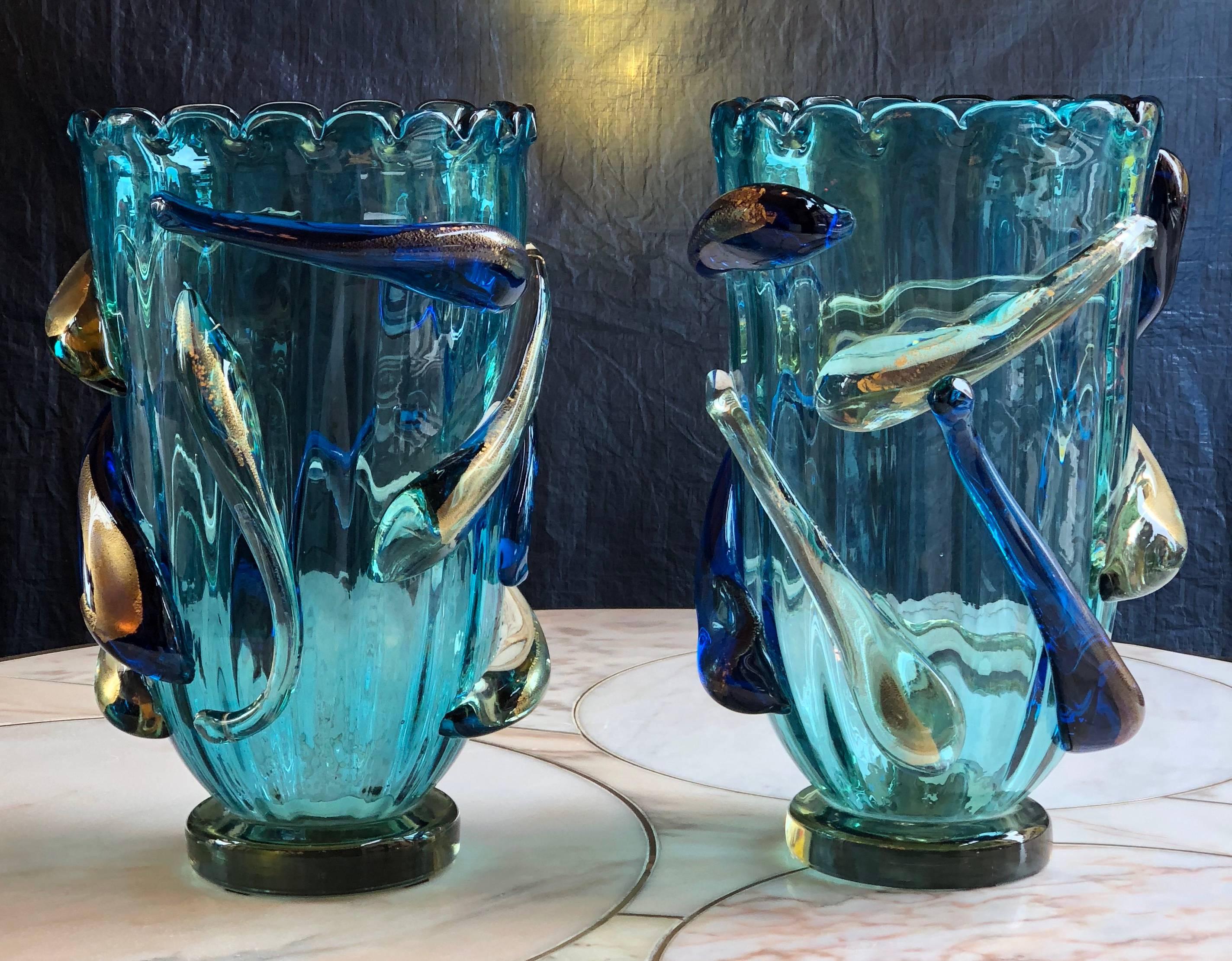 Late 20th century pair of turquoise blue and gold Murano glass vases. Signed in the bottom by Costantini.