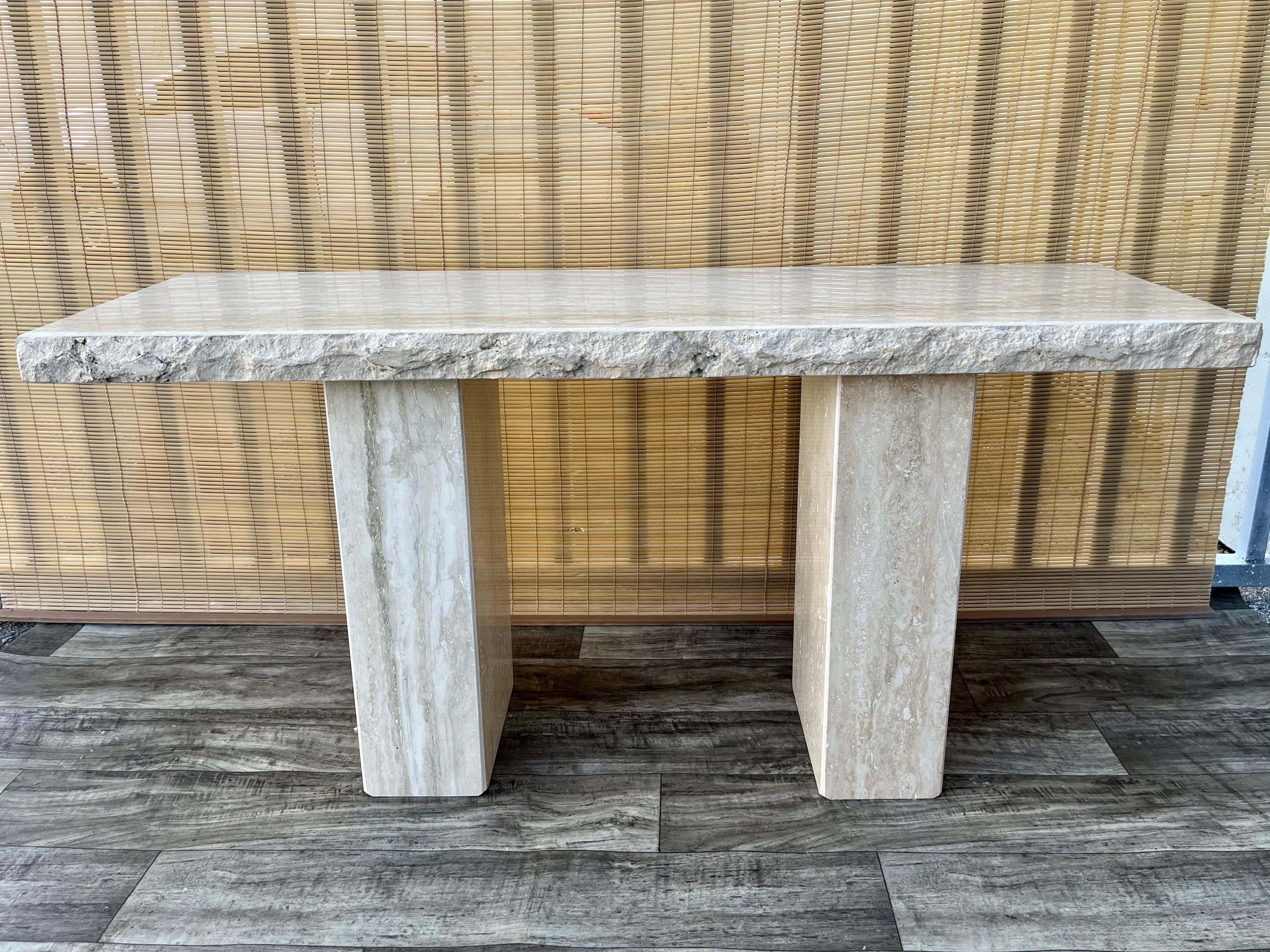 Late 20th Century Post Modern Live Edge Travertine Console Table by Stone International Italy.
Features 
Features a minimalist design with a light tan polished travertine stone, with beautiful natural stone veins and grain, raw edges and supported