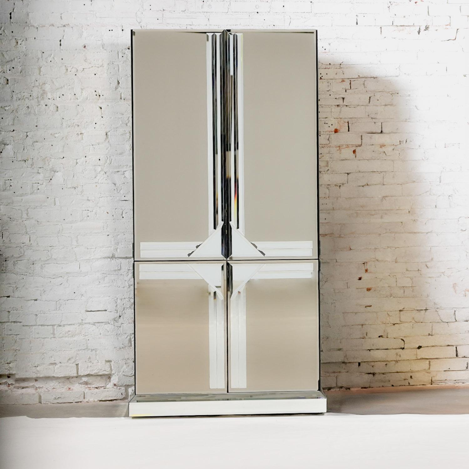 Marvelous vintage Postmodern to Art Deco Revival or Hollywood Regency layered mirrored entertainment cabinet, in the style of Ello Furniture Manufacturing. Beautiful condition, keeping in mind that this is vintage and not new so will have signs of