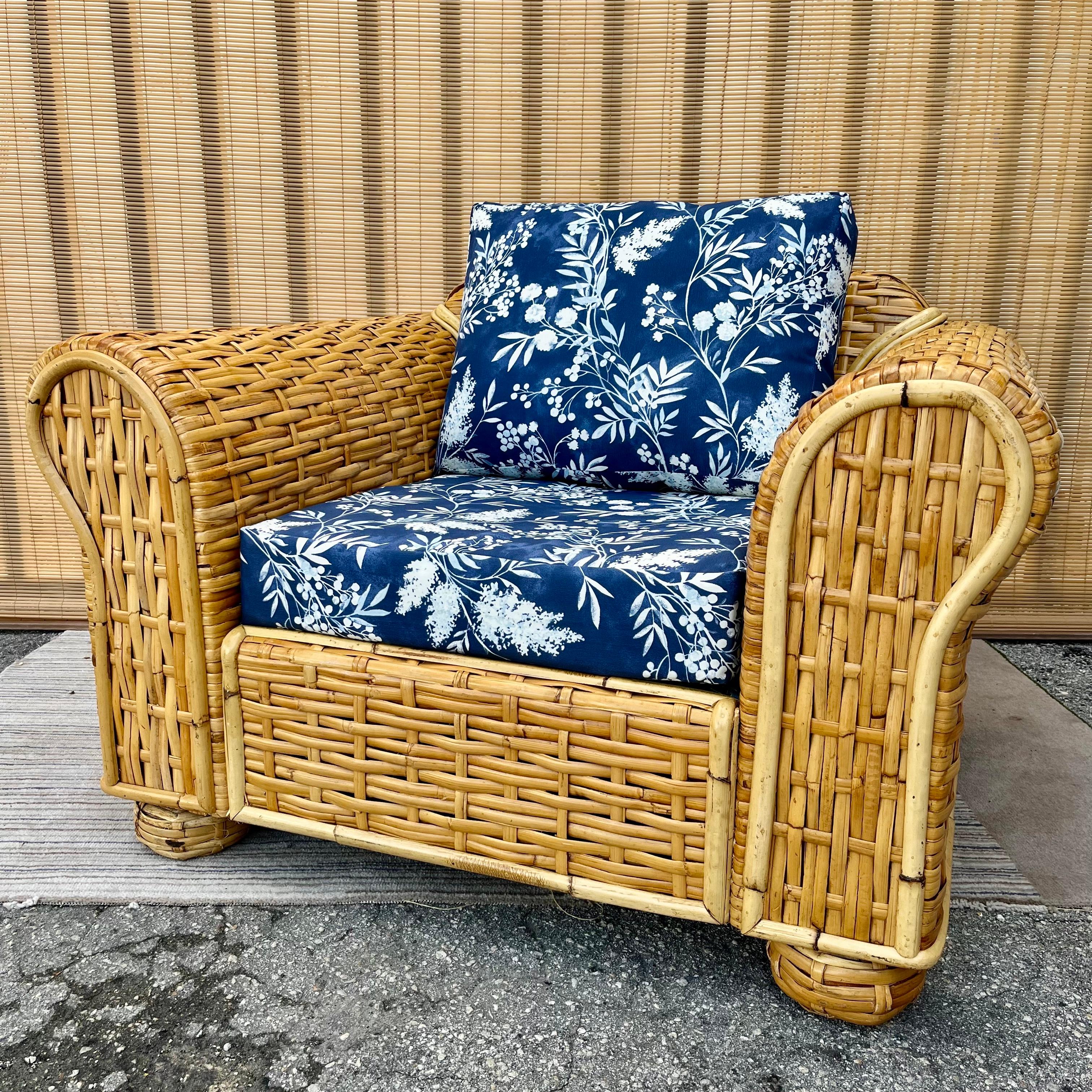 Vintage Late 20th Century Ralph Lauren Coastal Style Woven Rattan lounge chair. Circa 1980s.
Features a generous size woven rattan frame with rounded armrest and newly made removable cushion. 
The frame is in a very good original cosmetic and