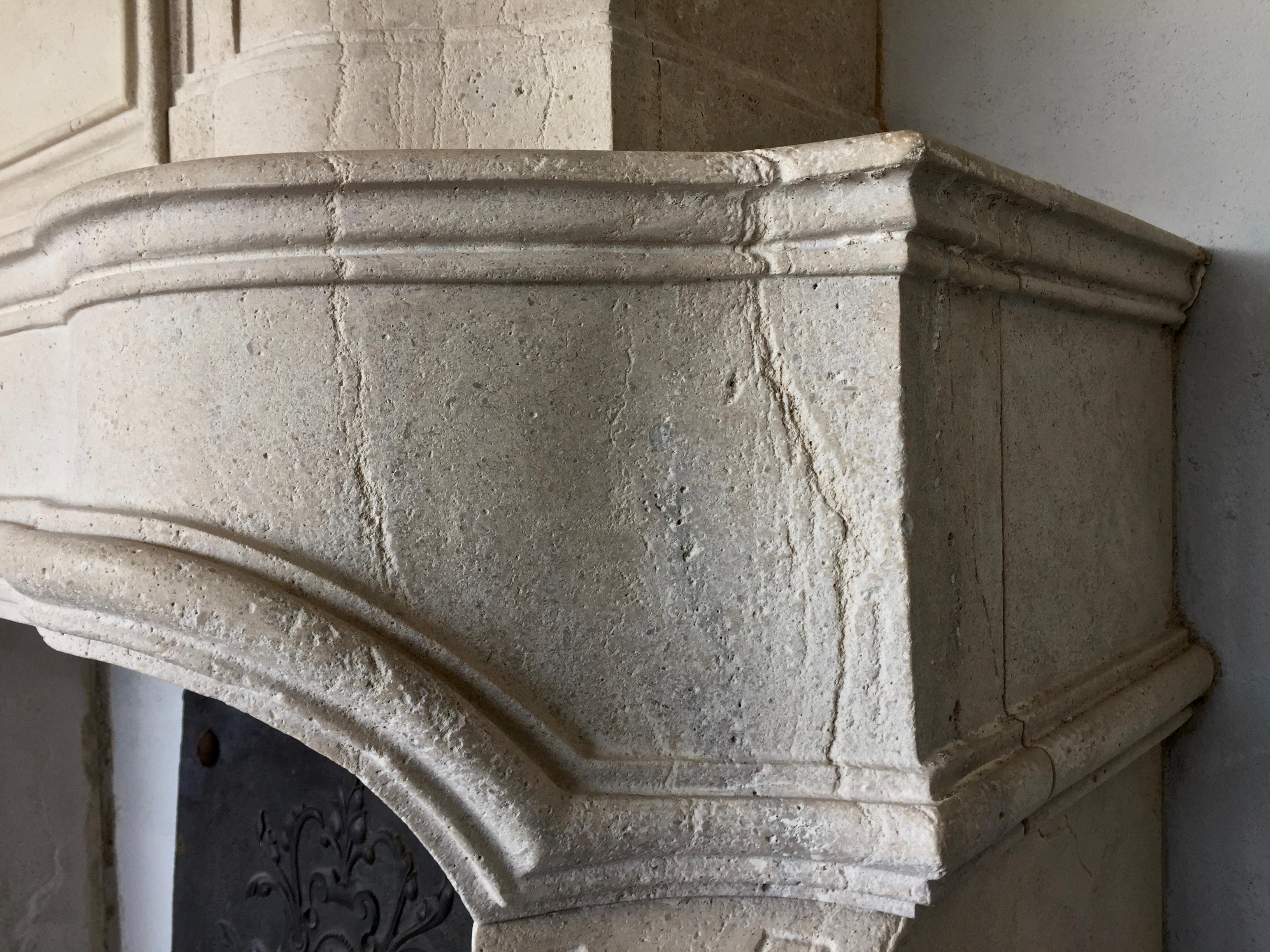 French Late 20th century Re-edition Louis XIV style fireplace aged limestone For Sale