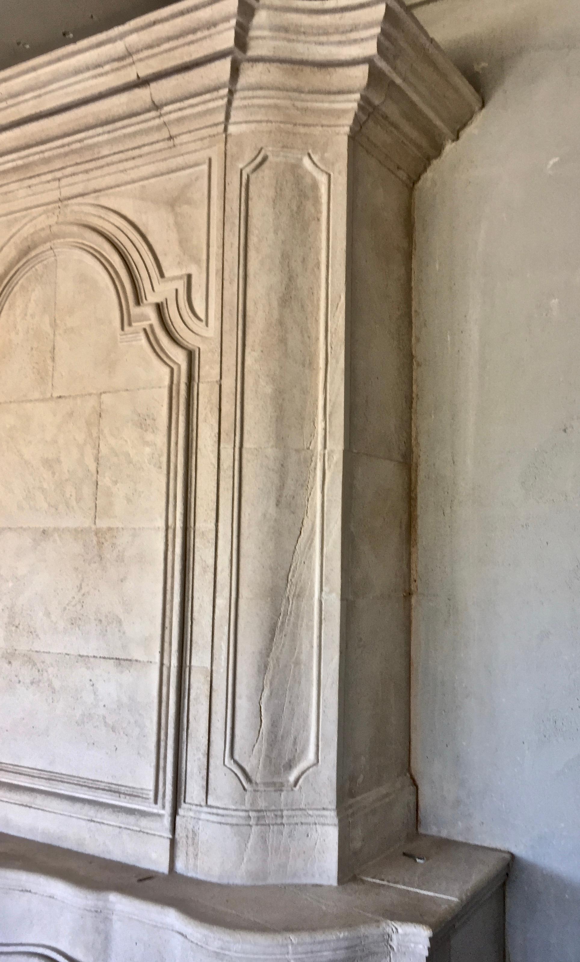 Hand-Carved Late 20th century Re-edition Louis XIV style fireplace aged limestone For Sale
