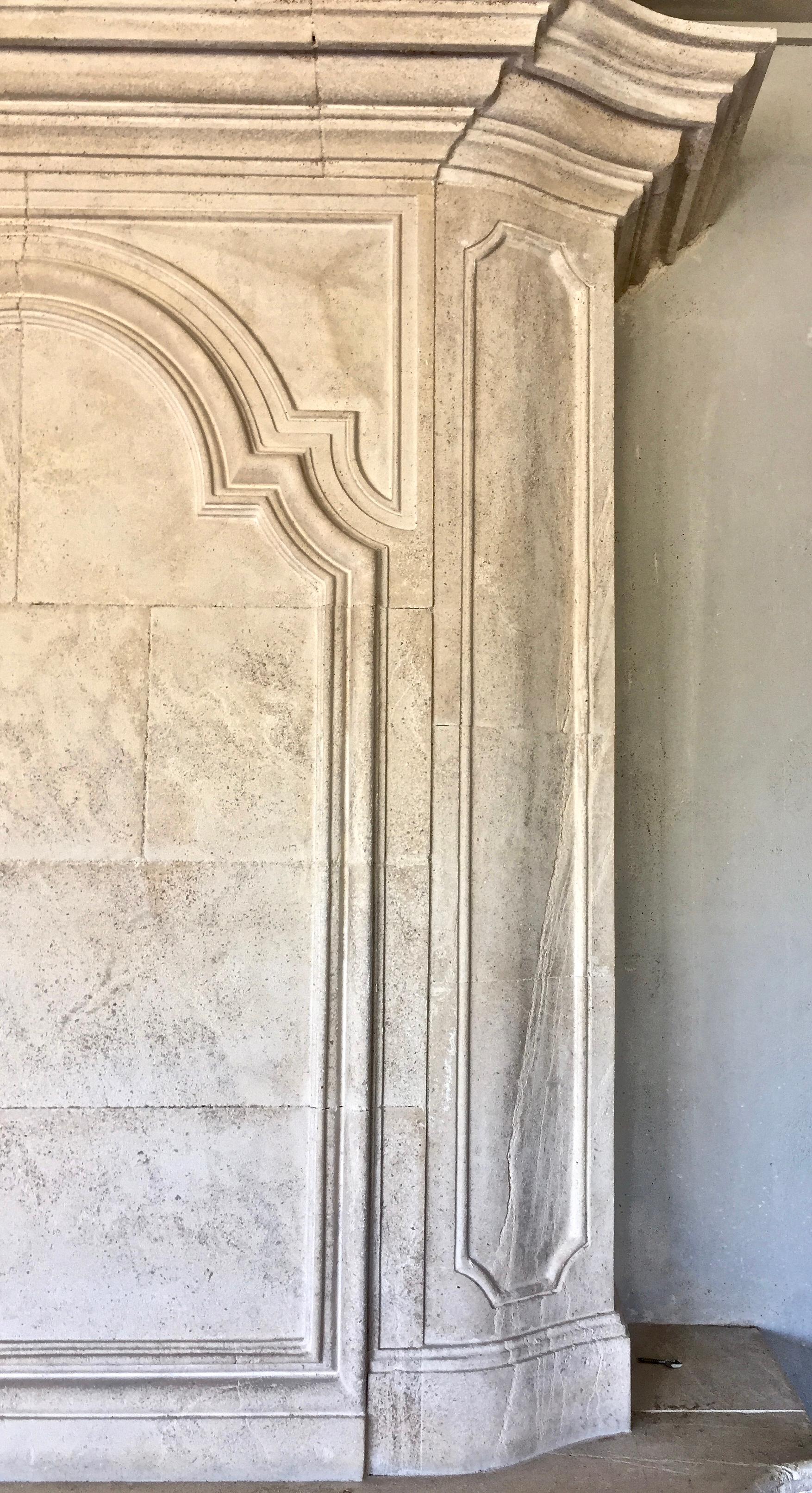 Limestone Late 20th century Re-edition Louis XIV style fireplace aged limestone For Sale
