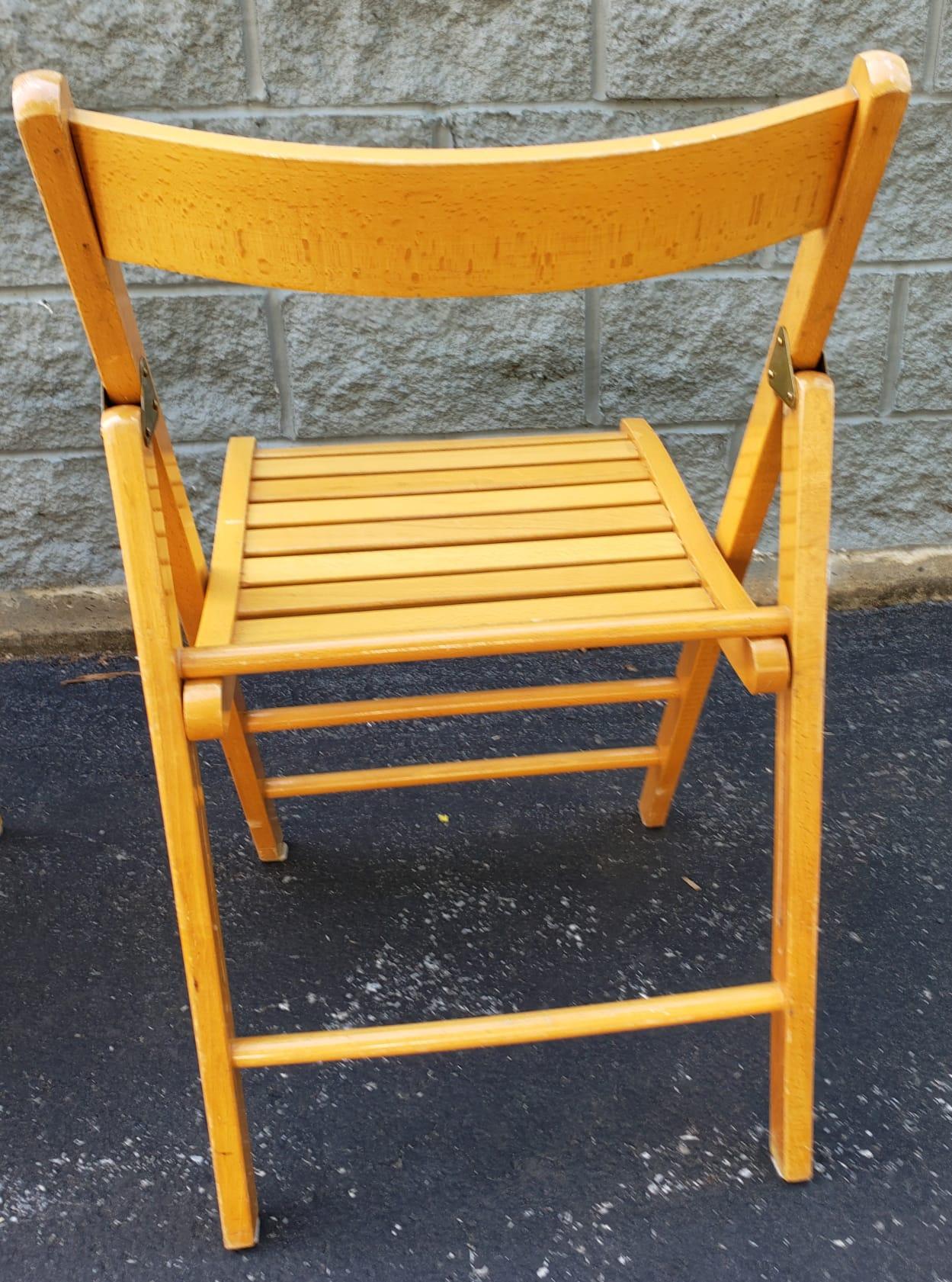 Set Of Four Italian Maple Folding Chairs in good vintage condition.

