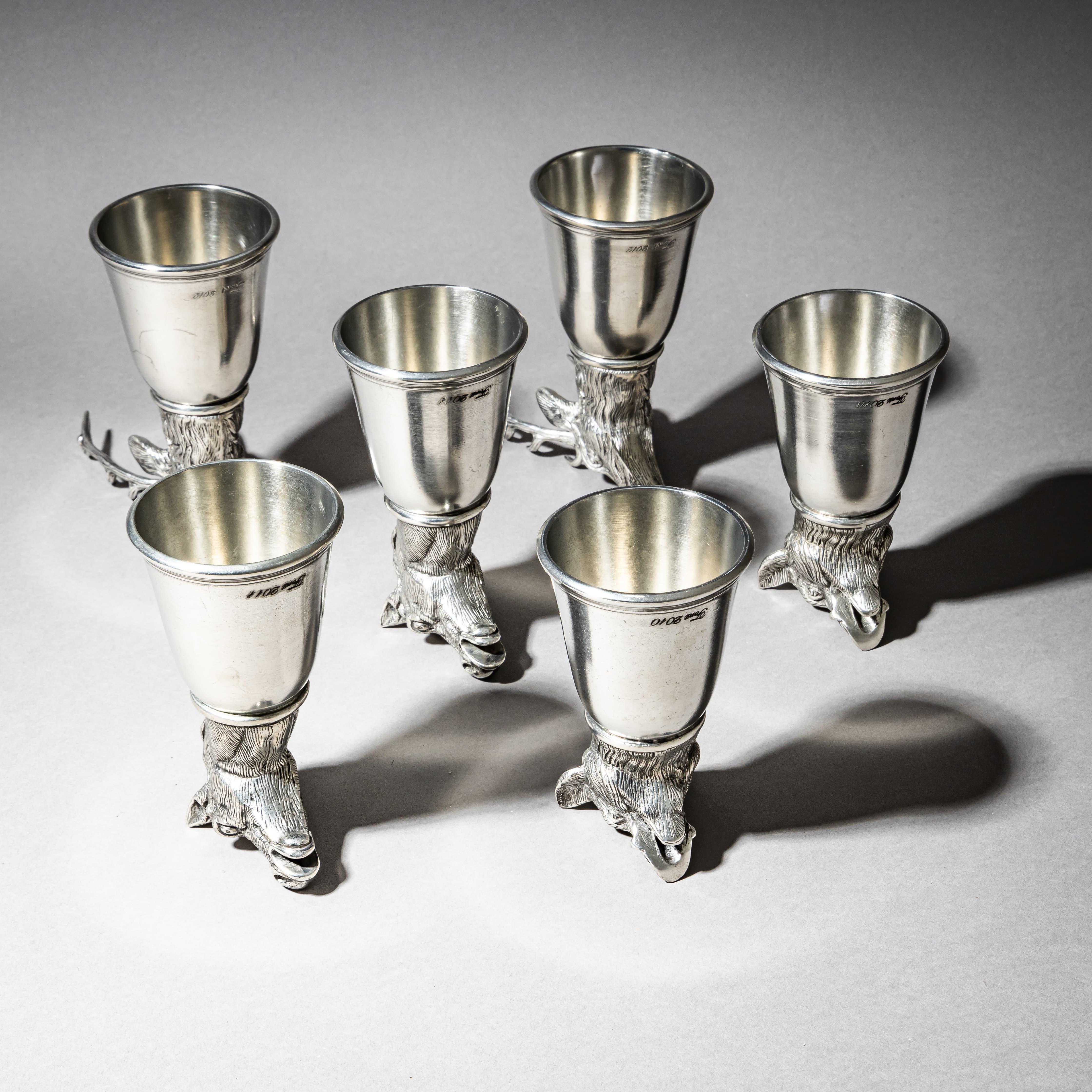 Set of six pewter stirrup cups (marked 95% pewter) made by the Italian manufacturer Forst in the 1970s. Each cup features a finely modeled animal head as its base: two wild boars, two stags, and two horses. Stamped along the rim with “Forst” and