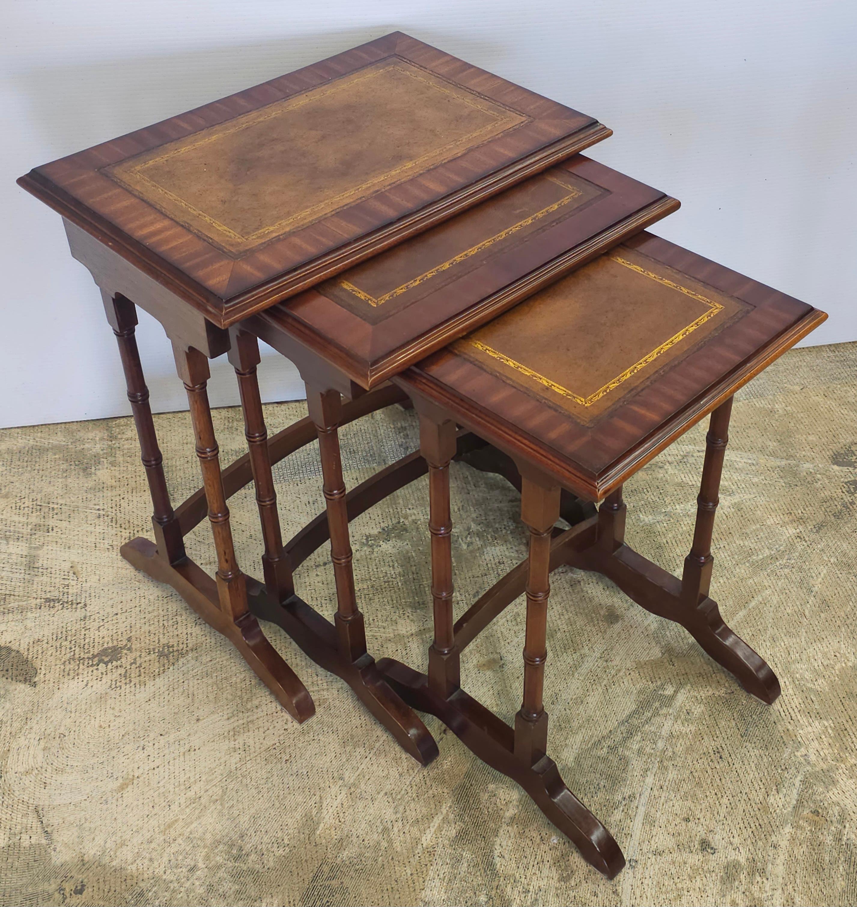 Late 20th Century Set of Three Mahogany Faux Bamboo and Stenciled Leather Top Nesting Tables.

Dimensions: 
20.5