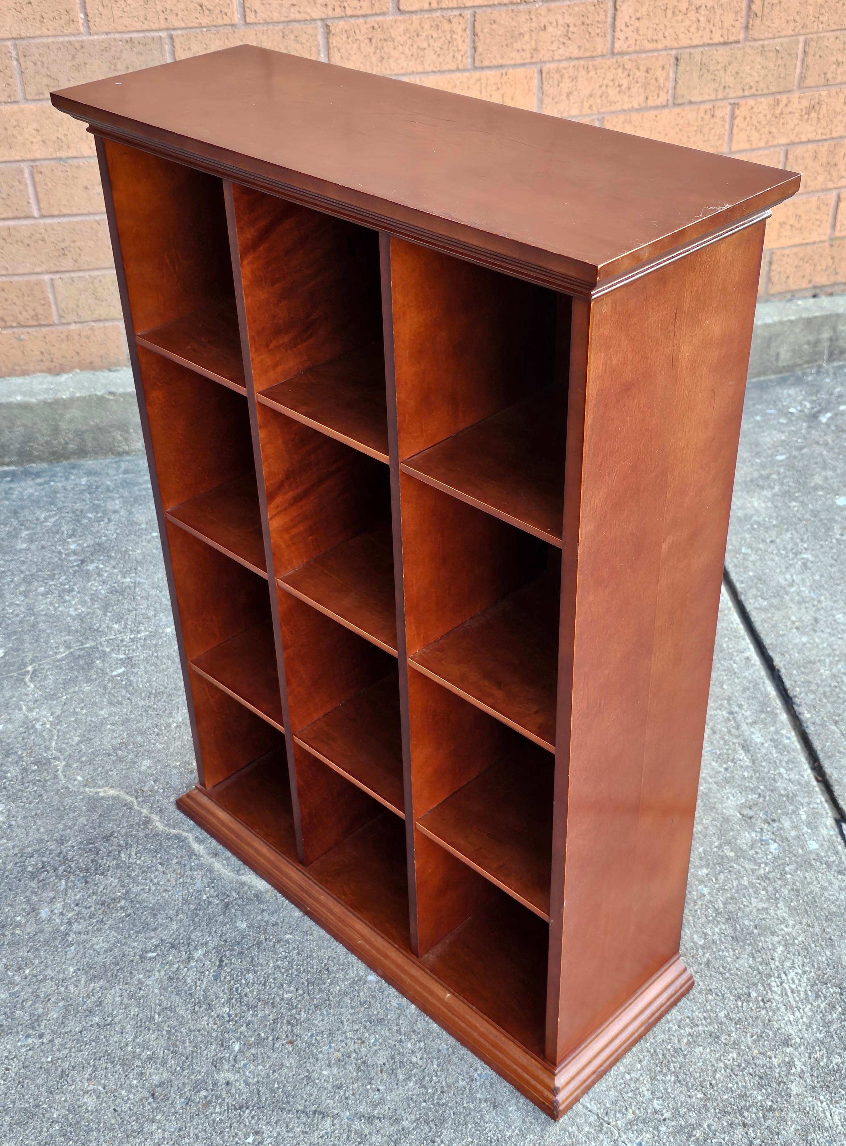 A Late 20th Century Solid Cherry Pigeon Hole Cube Bookcase in lacquered finish. Each cube measures 5.6