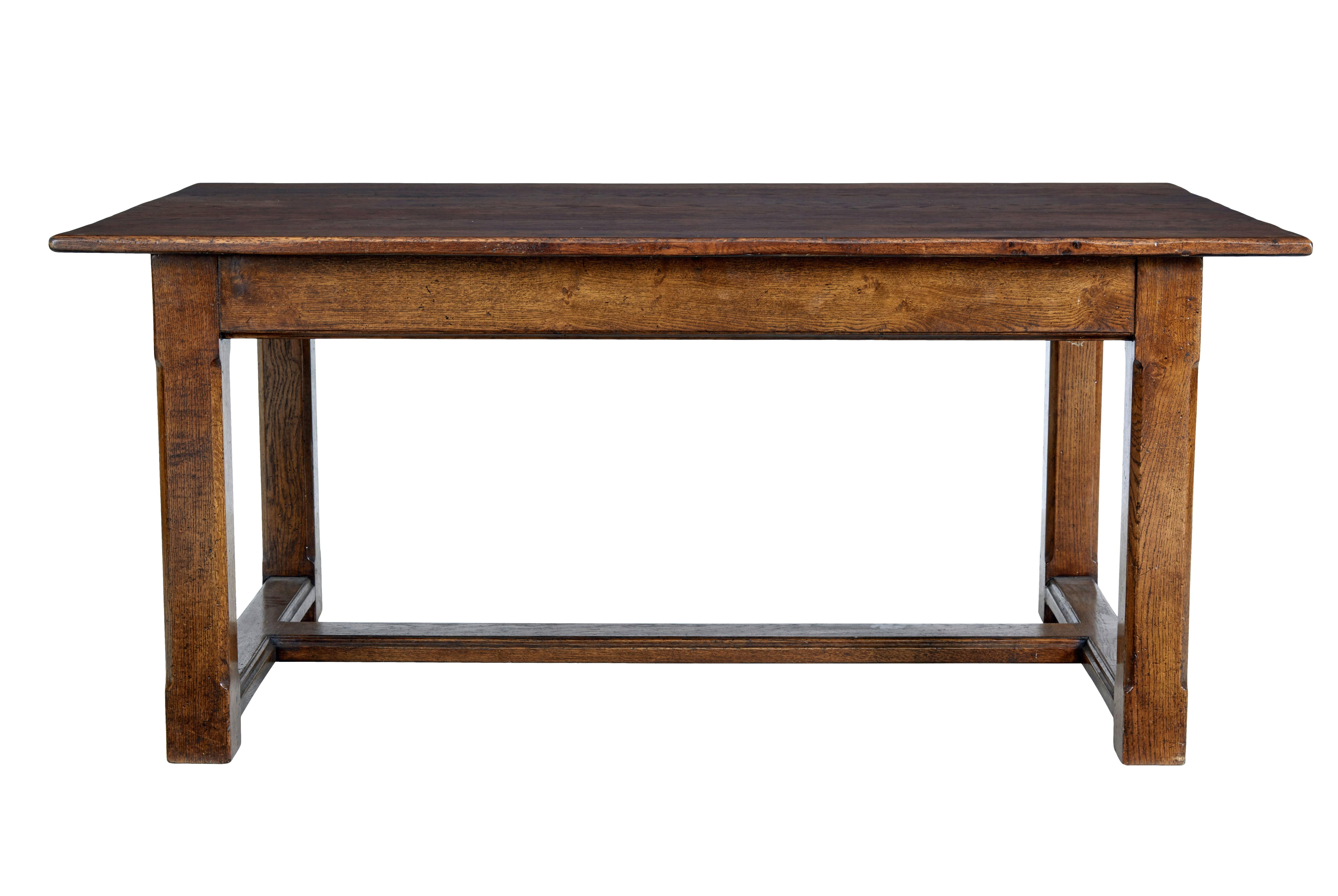 Late 20th century solid oak refectory table circa 1990.

Good quality English made oak refectory table made from seasoned oak.  7 plank oak top, standing on a straight leg base with fluted detail, united by h frame stretcher.

Very good size for