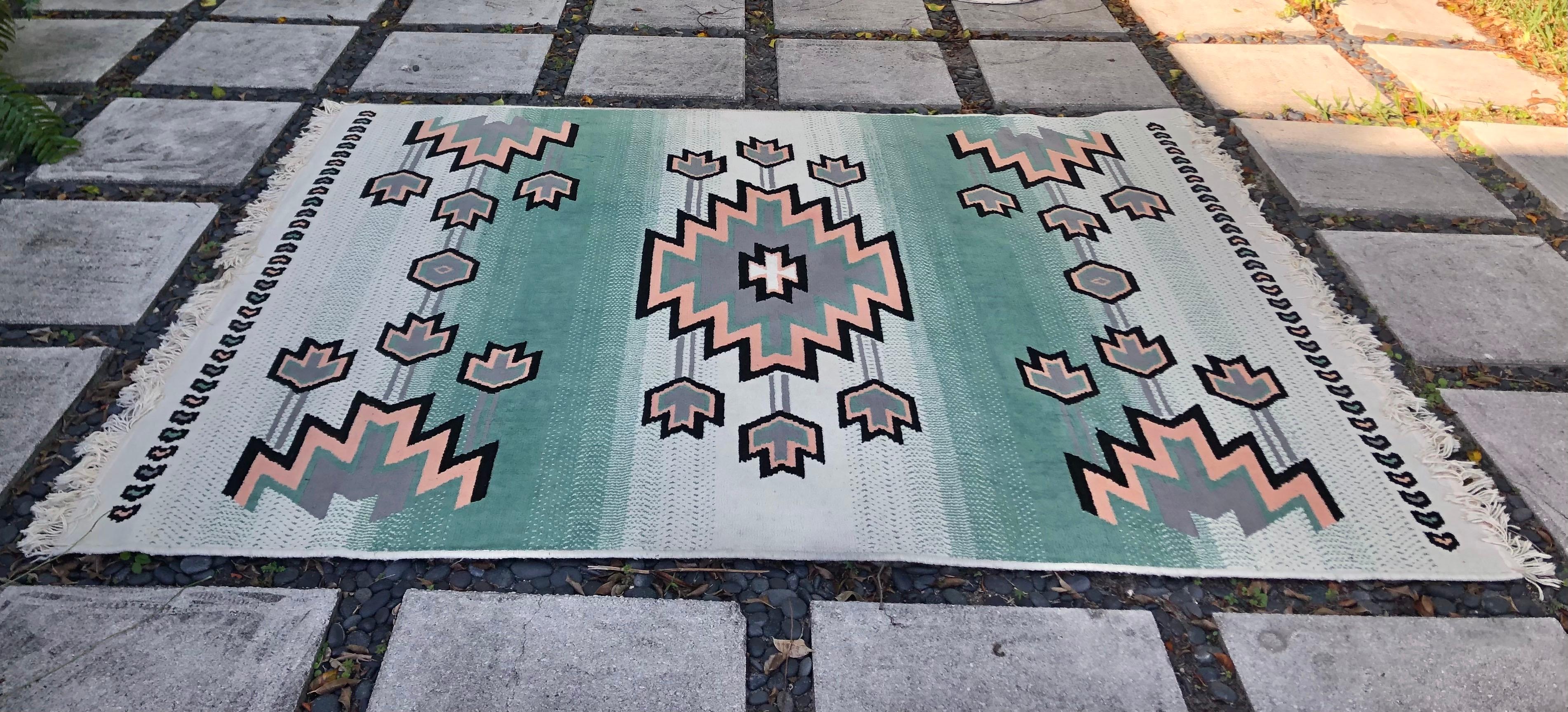 Vintage Southwest inspired style area rug. Circa 1980s.
This is a gorgeous Native American / Navajo art and textiles Inspired rug is rich pastel colors with tactile appeal that gives both luxurious comfort and versatility when working with a