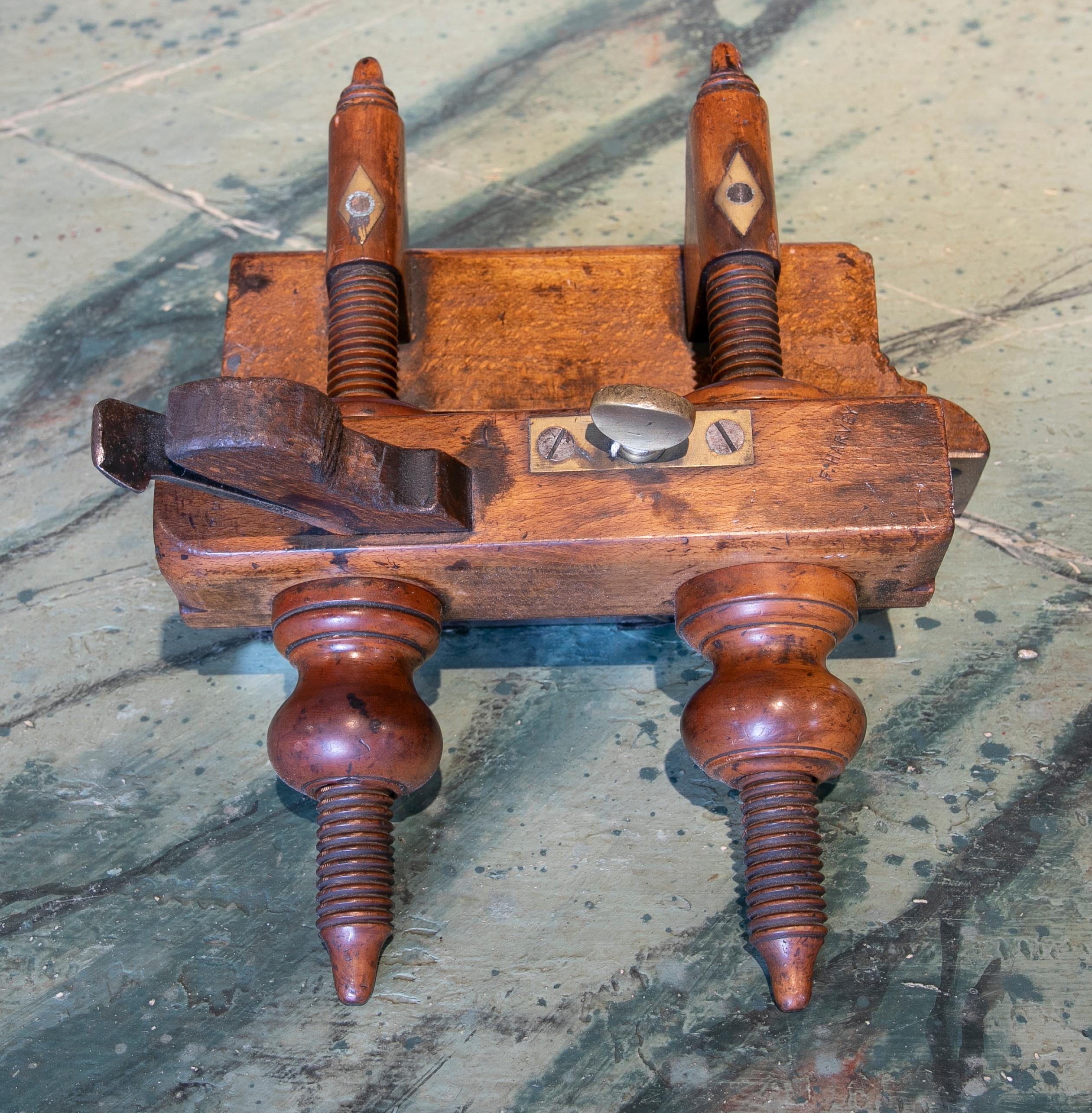 Rustic weathered 1970s Spanish walnut carpenter's tool with bronze fittings and inserts decorations.