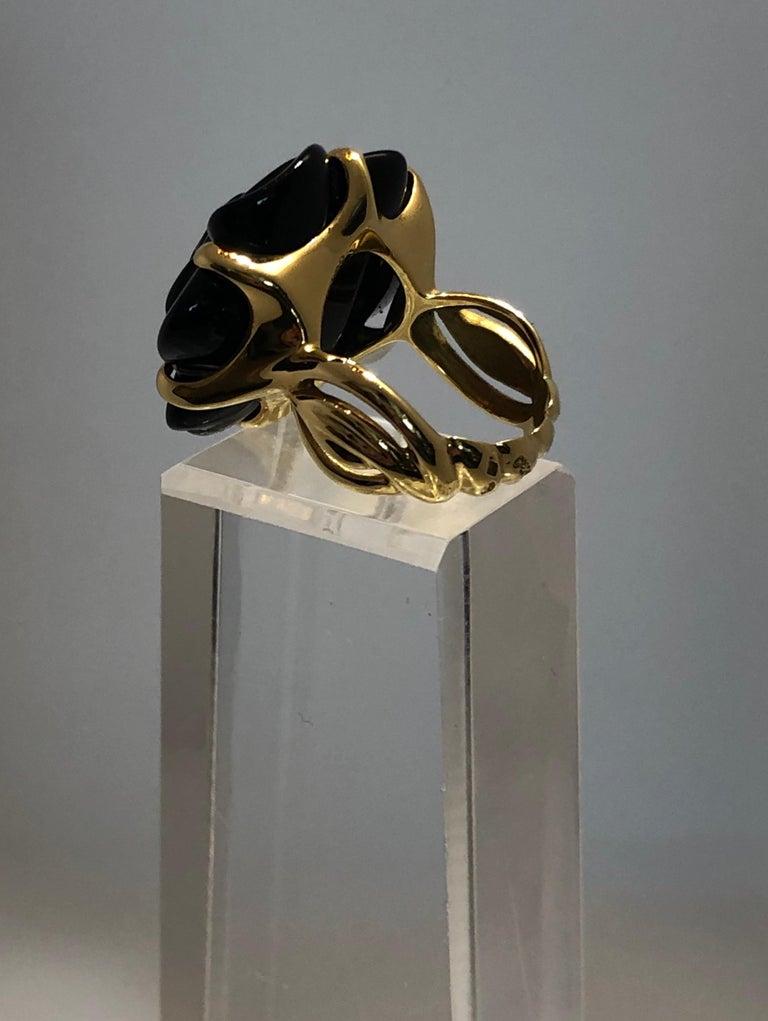 Offered is a signed and stamped 18-karat late 20th century (1999) Chanel black onyx and 18-karat yellow gold 