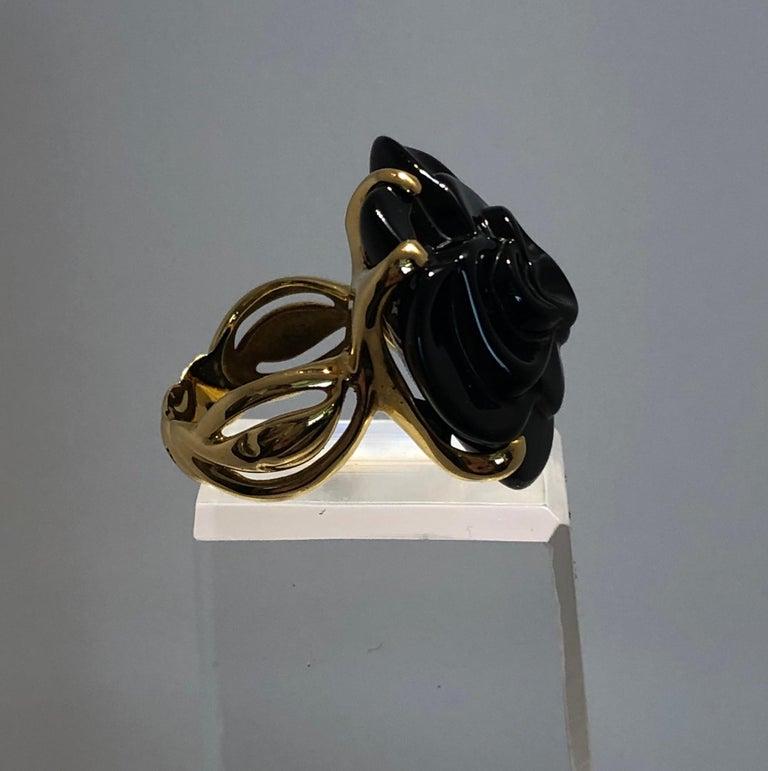 Modern Stamped Chanel Black Onyx and 18-Karat Gold Camellia Cocktail Ring For Sale
