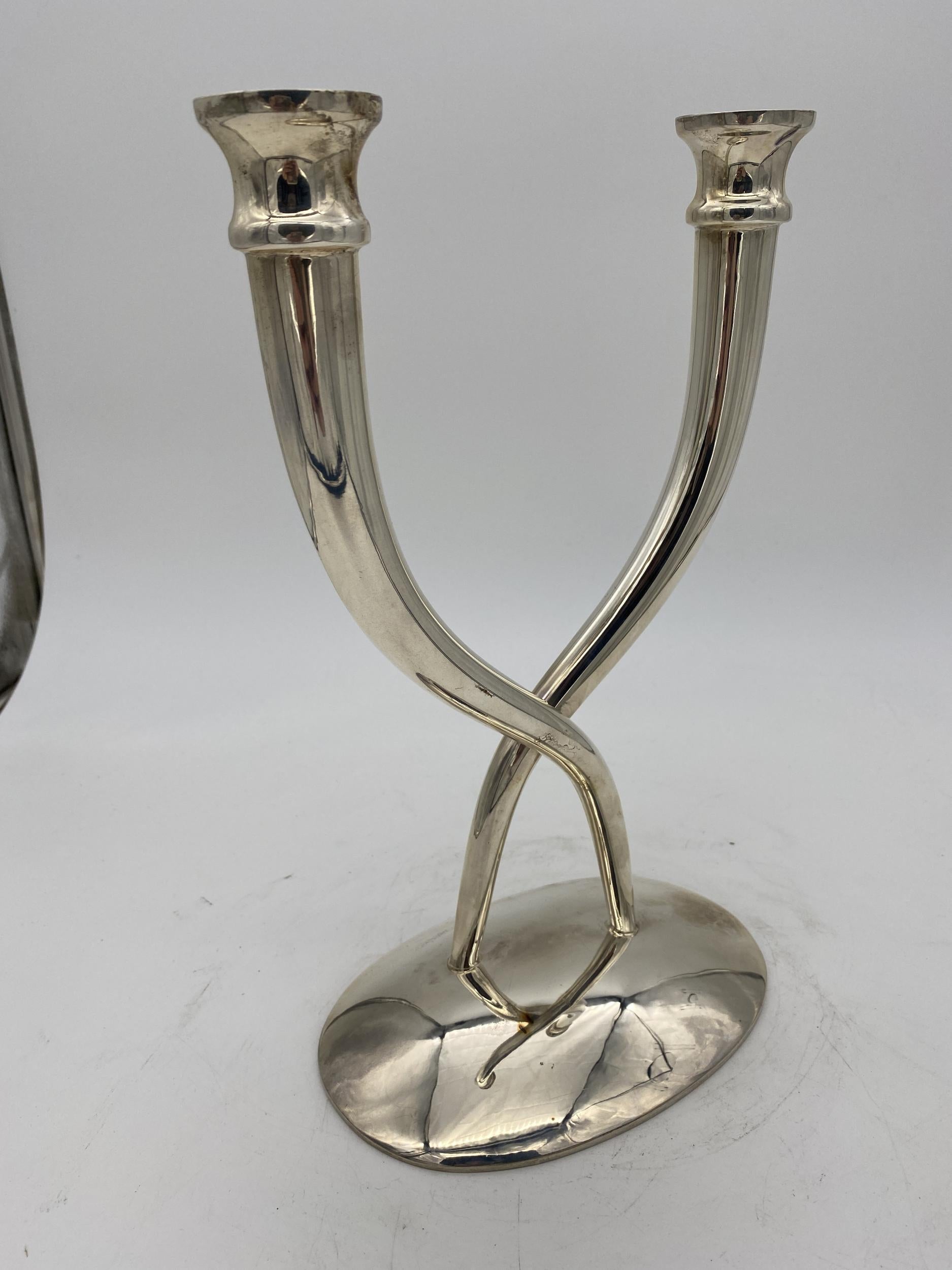 Late 20th century sterling silver candle holder pair featuring 2 double arms on each holder with free-form base.

Stamped: Sterling silver villa
Circa 1980

Candle stick: 12.5