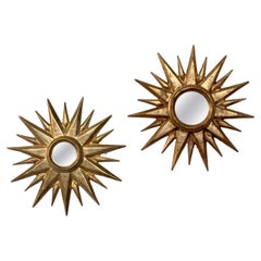 Paire de miroirs dorés, sculptés et ensoleillés, de la fin du 20e siècle