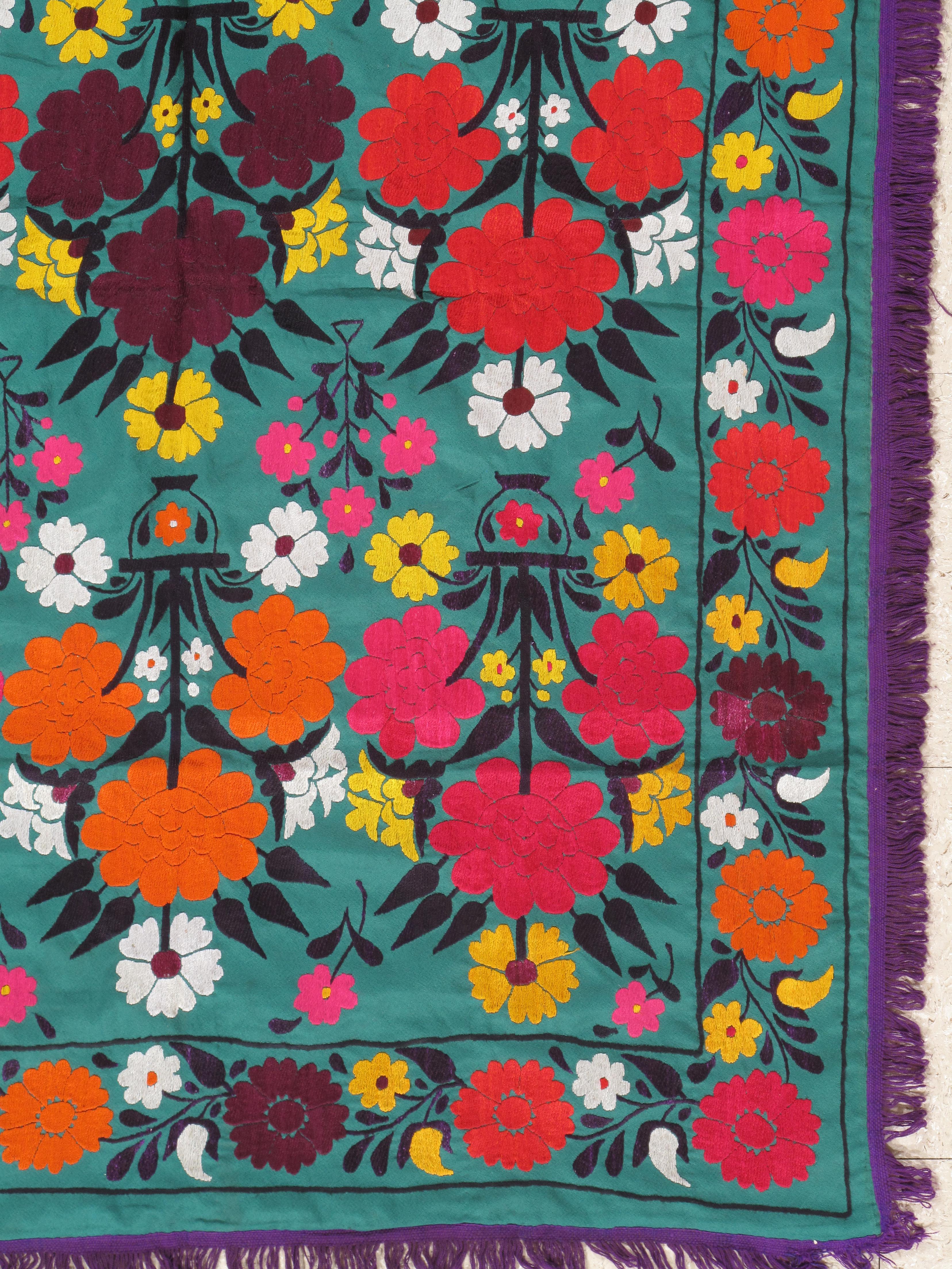 Finely woven cotton-ground Vintage Suzani with hand-embroidery. Fine floral design. This Suzani embroidery has the most noticeable, soporific color pallet. Very fine, 20th century Suzani textile. With vibrant silk highlights. 

Measures: 3'7