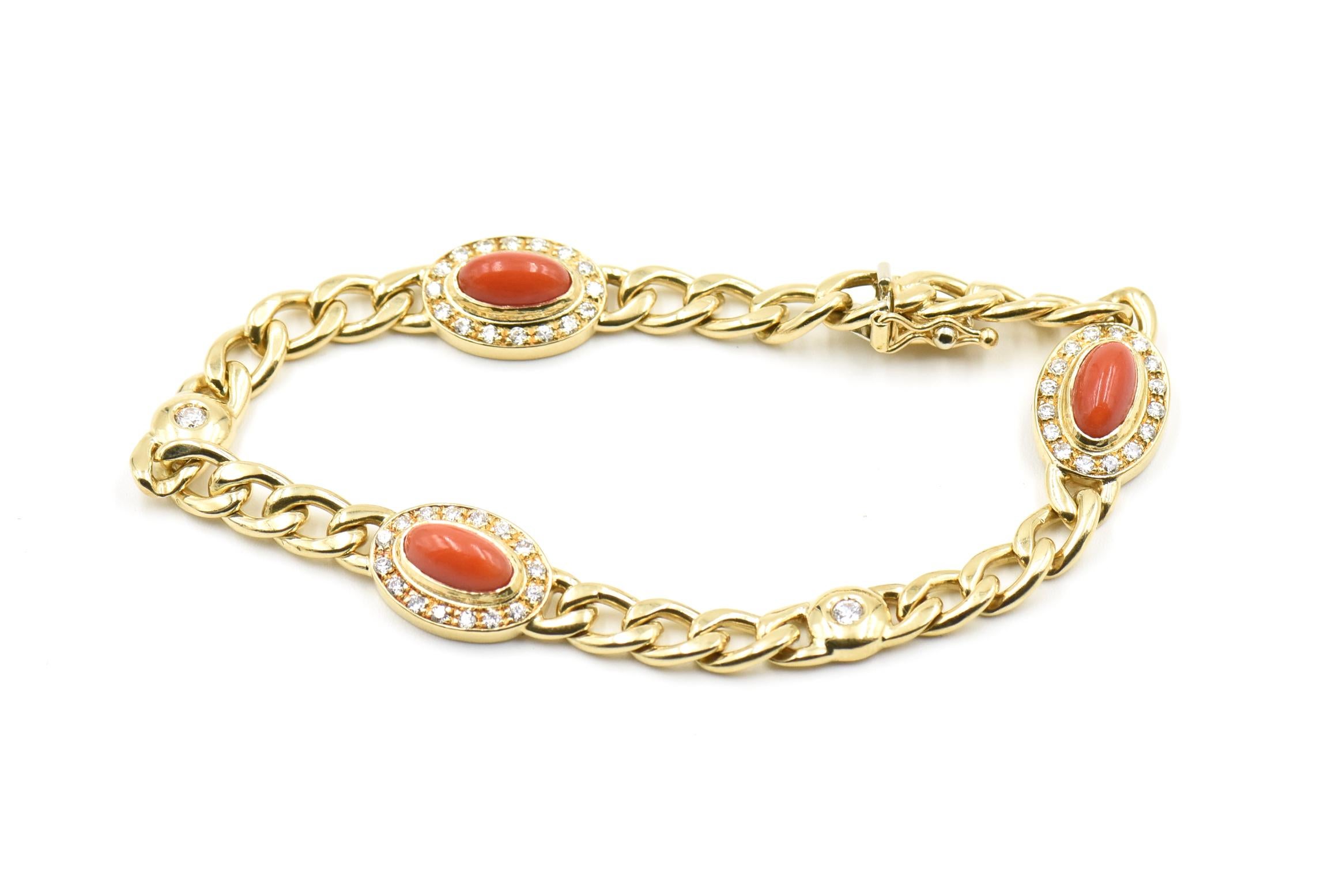 Classic 18k gold chain by Italian jeweler Unoaerre. The chain is accented by three oval red coral cabochons that are framed by diamonds.  Another 2 diamonds in gold circles accent the links.

Marked with  UnaAErre Hallmark and 750 on the
