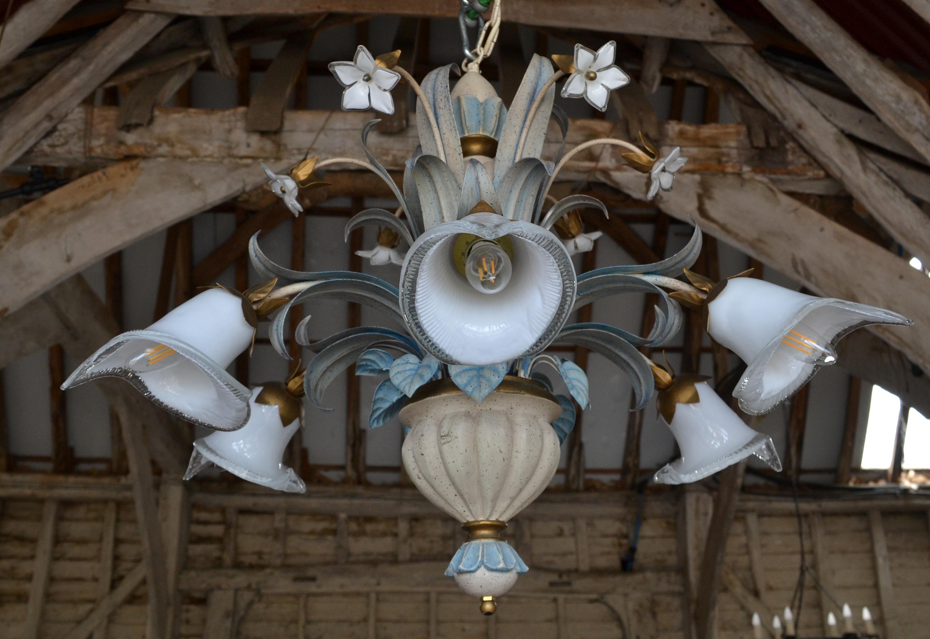 An unusual Ferroluce 6 light chandelier. It has a speckled ceramic stem, painted metal leaves and beautiful white Venetian flowers and shades. Circa 1990. 

