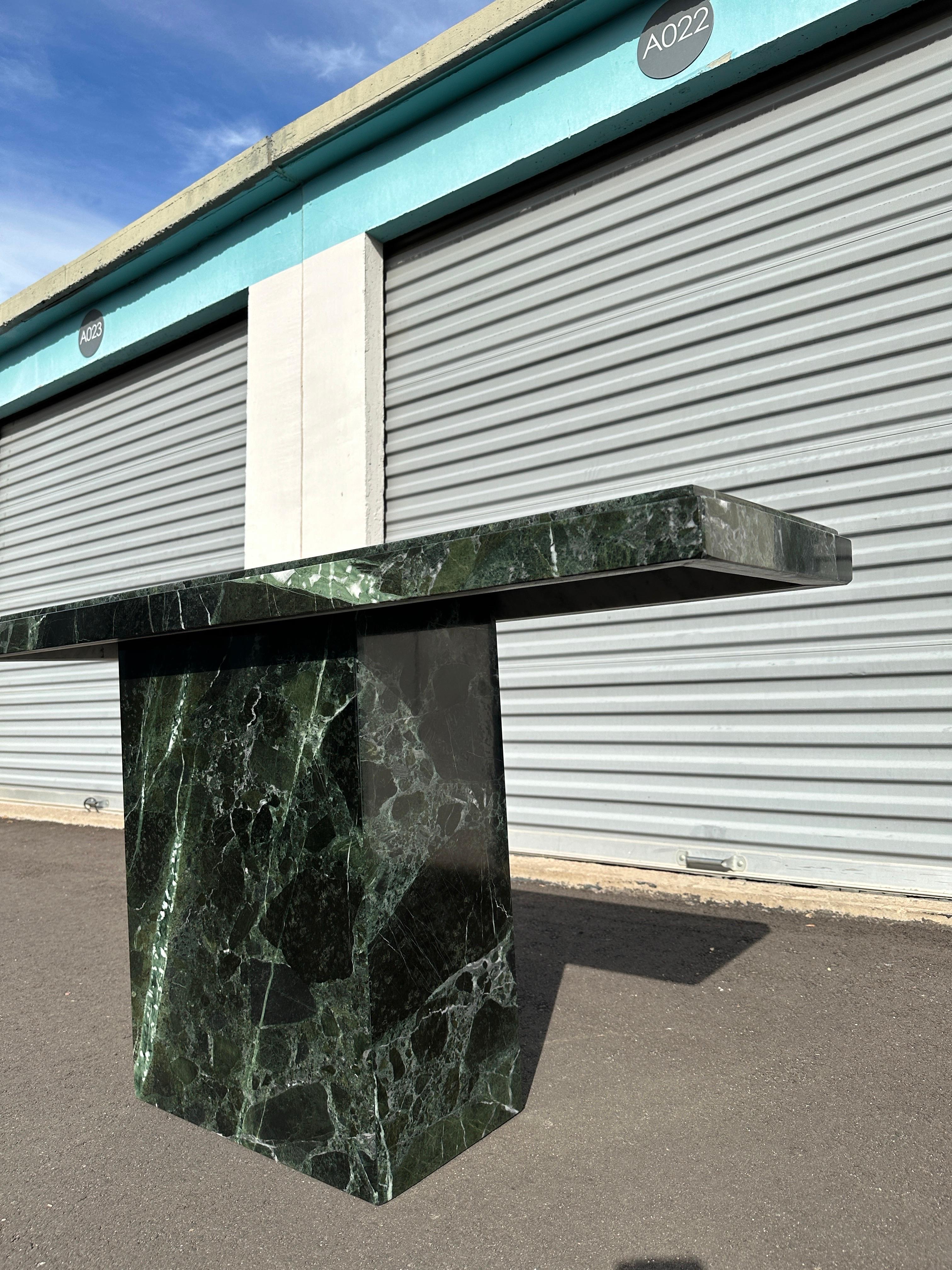 Sculptural and unapologetically bold, this late 20th century console table is crafted from Verde Alpi marble — a stone prized for its deep green base and vivid white veining. Rare in both material and scale, it has a presence that immediately