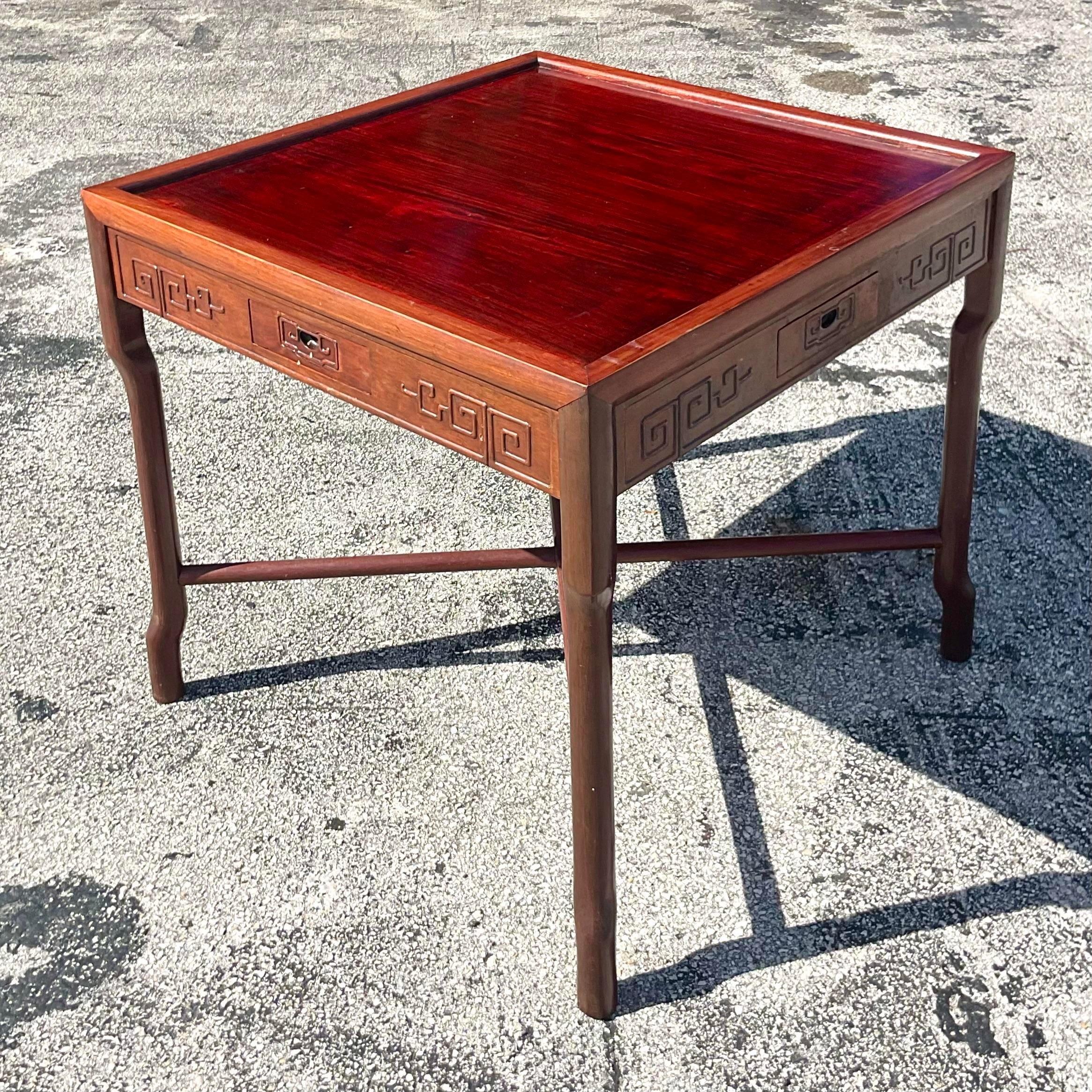A stunning vintage Asian game table. Gorgeous fretwork detail with individual players drawers on each side. Perfect for your extra aces! Perfect as in or lacquer it a great color to match your project. You decide! Acquired from a Palm Beach estate.