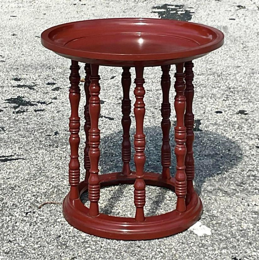 A fabulous vintage Asian side table. A chic little occasional table perfect for drinks, the remote or your orchid. You decide! Turned wood legs and a lacquered Merlot finish. Acquired from a Palm Beach estate.