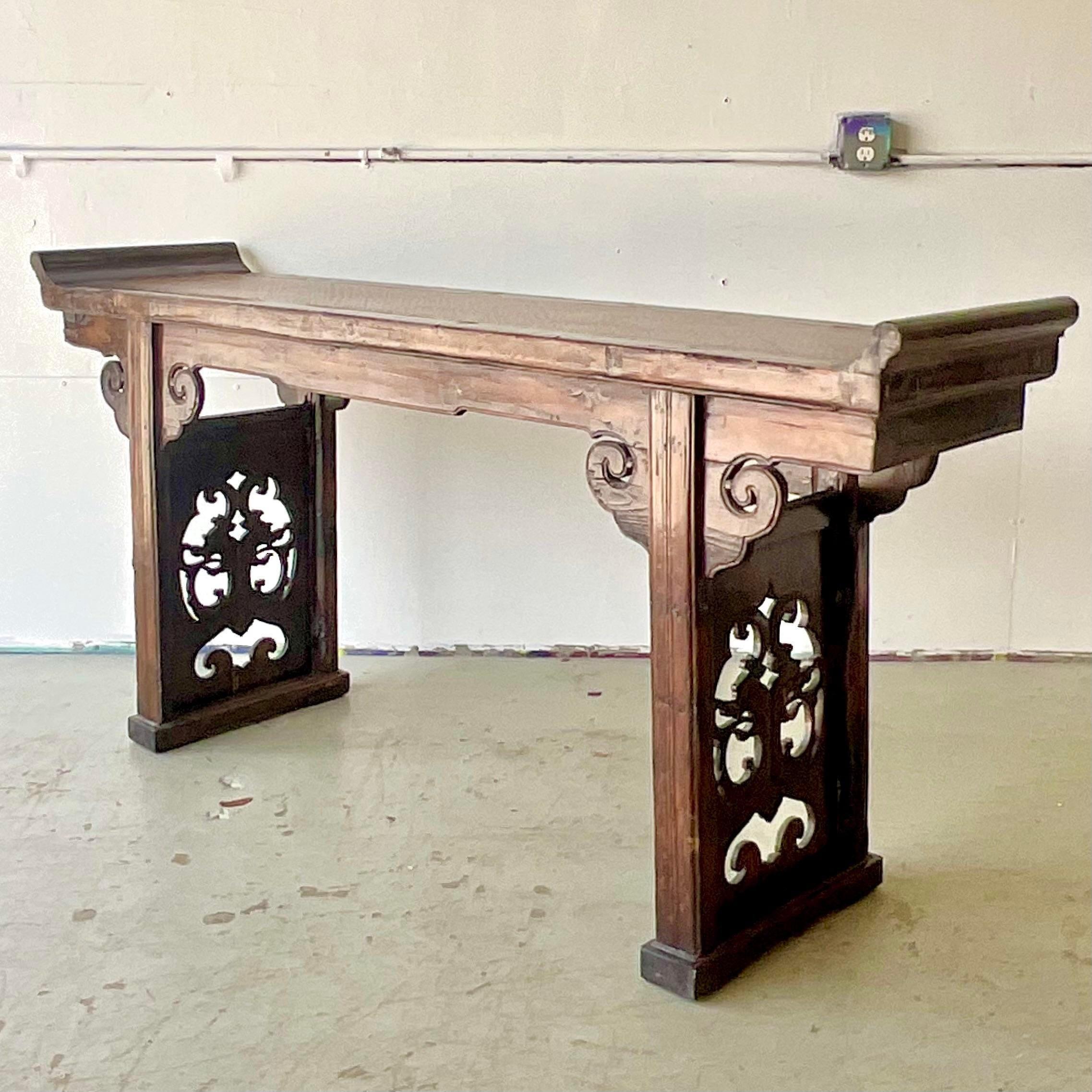 A fantastic vintage Asian console table. A chic pagoda wing design with a classic altar shape. Acquired from a Palm Beach estate.