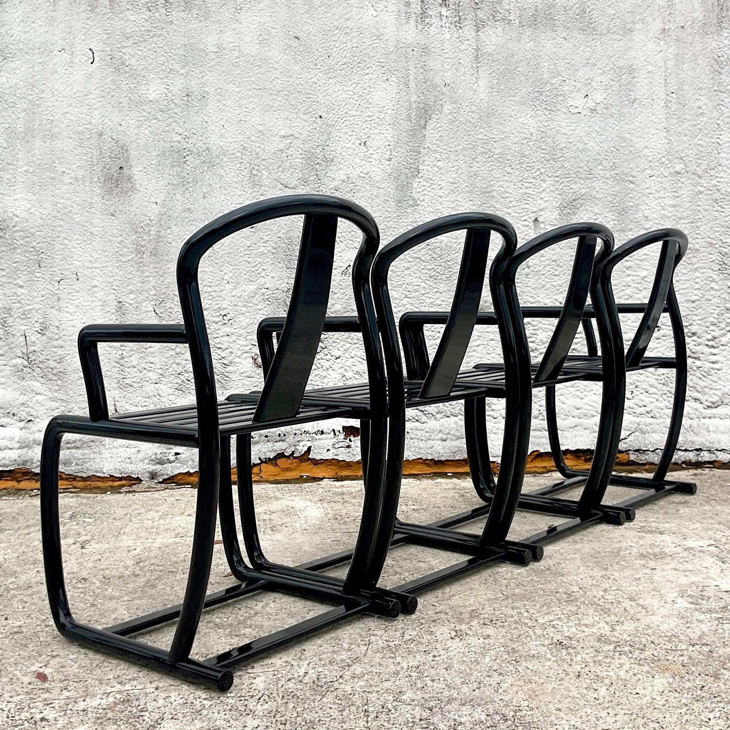 A fantastic set of 4 vintage Postmodern chairs. A chic gloss black lacquer in a beautiful contemporary shape. Made in Italy and marked on the bottom. Acquired from a Palm Beach estate.