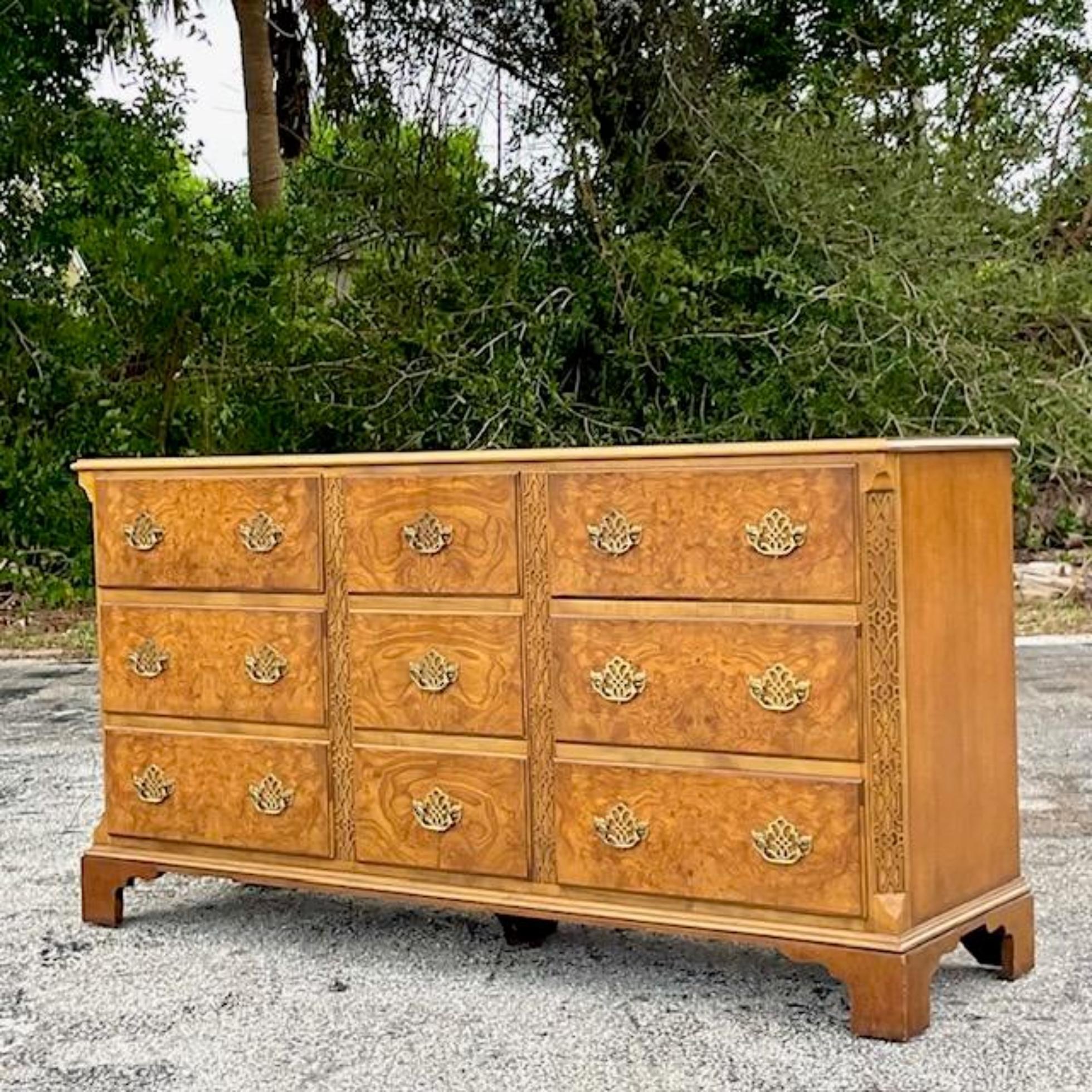 A stunning vintage Boho standard 9 drawer dresser. Made by the iconic Baker group and tagged inside the drawer. A fantastic Burl wood cabinet with a carved fretwork trim. A beautiful warm patina from time. Coordinating pieces also available on my