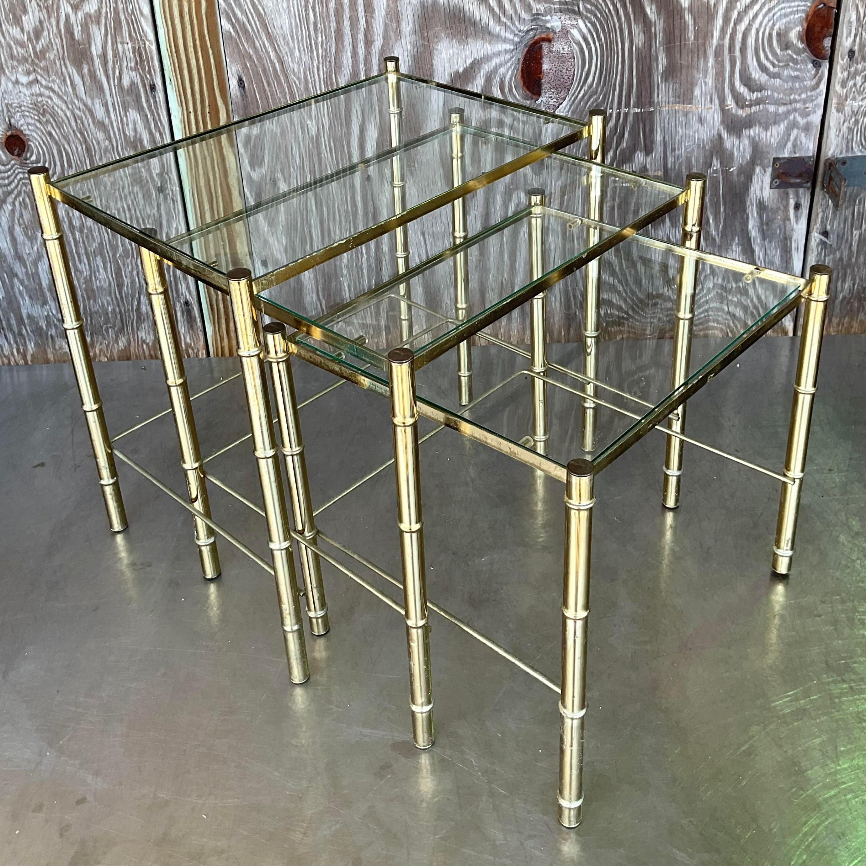 Enhance your decor with these Vintage Boho Brass Bamboo Nesting Tables. Their elegant brass bamboo design and versatile nesting functionality bring a touch of bohemian chic and practical style to any room.

Second table - 17.5x13.5x16.75
Third table