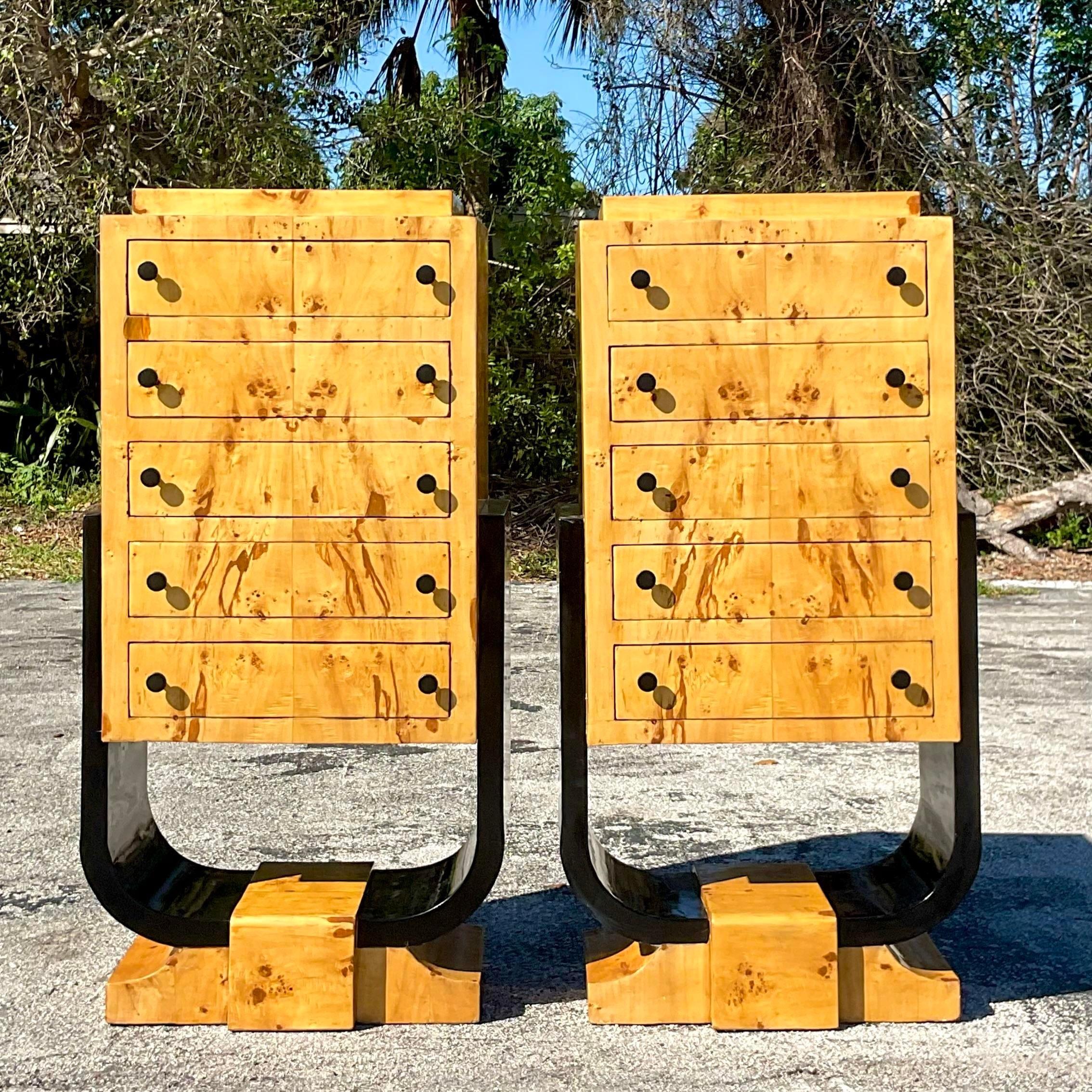 A fantastic pair of vintage Boho tall chest of drawers. A chic Deco design with an elevated Burl wood cabinet resting on black lacquered plinths. Acquired from a Palm Beach estate. 