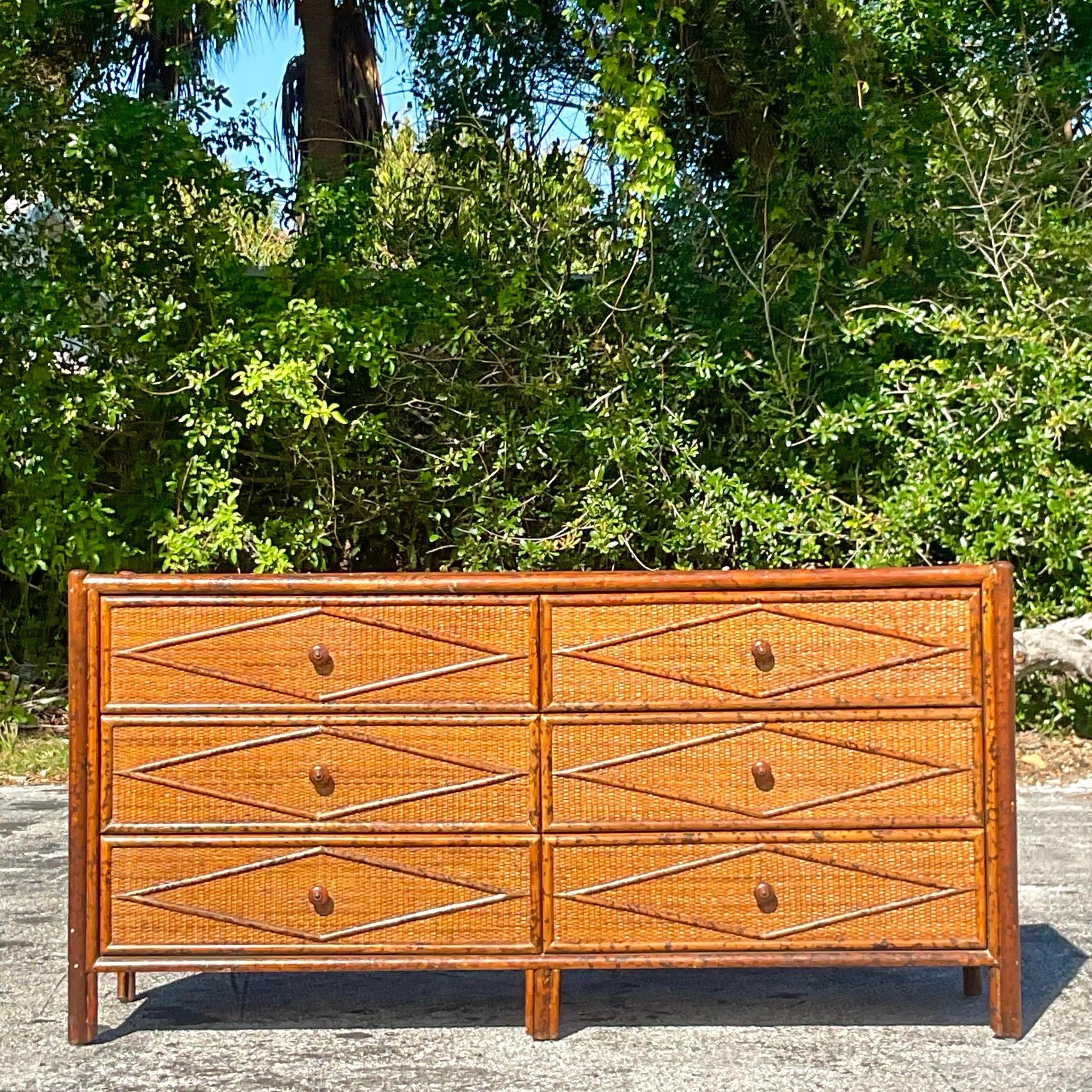 Bohemian Chic Meets Rustic Elegance: The Vintage Burnt Bamboo Diamond Dresser. Add a touch of American flair to your space with this unique piece, blending eclectic boho vibes with the warmth of natural materials for a statement dresser that's both