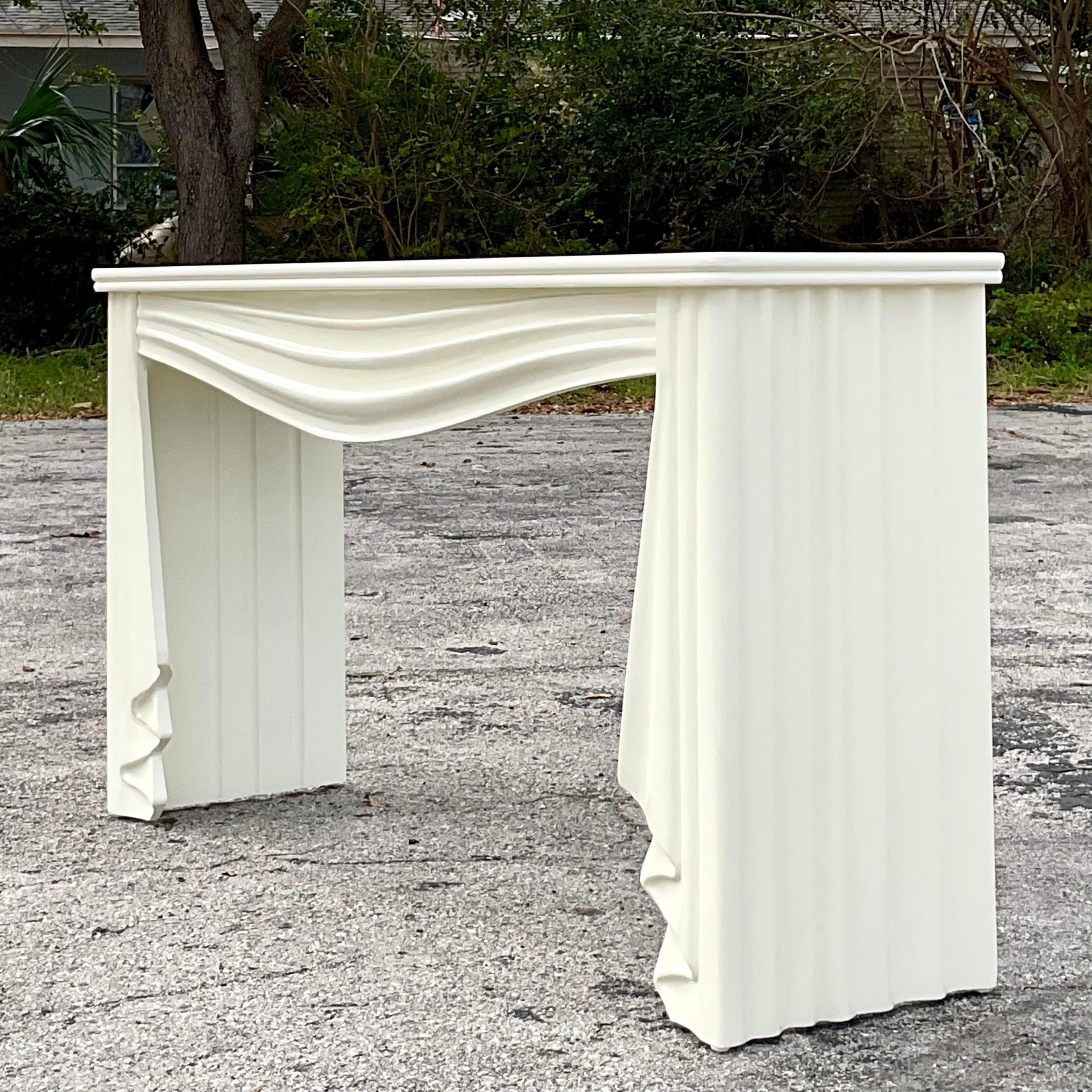 A fabulous vintage Boho console table. A chic hand carved swag design in a Parzinger white finish. Perfect to add a little flash of drama to any space. Acquired from a Palm Beach estate