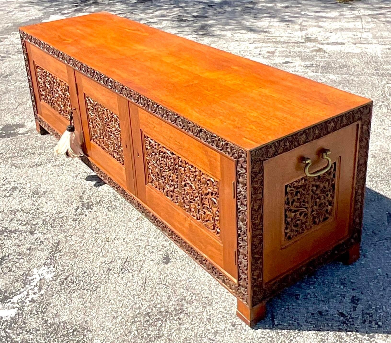 An extraordinary vintage Boho long credenza. Incredible hand card details and heavy brass hardware. A slightly lower profile gives this piece a sexy look. Lots of great interior storage. Acquired from a Palm Beach estate. 