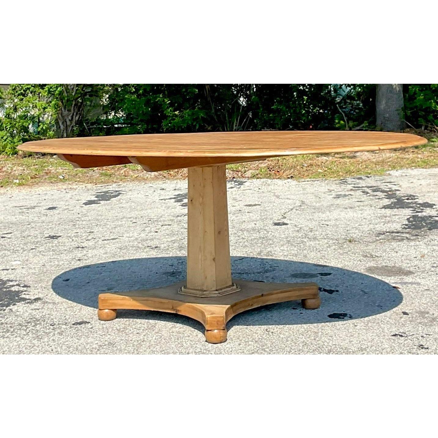 North American Late 20th Century Vintage Boho Center Pedestal Oval Pine Dining Table