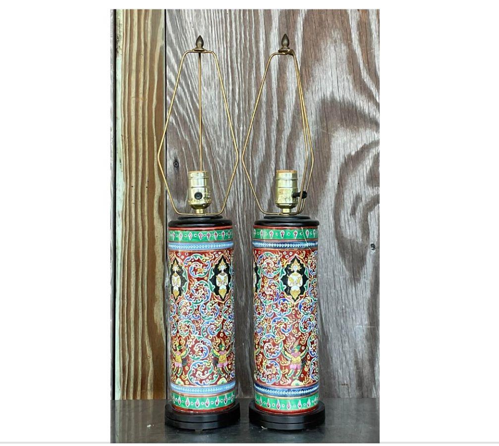 A chic pair of vintage Boho table lamps. A beautiful paisley temple scene on a cylinder shape. Acquired from a Palm Beach estate. 