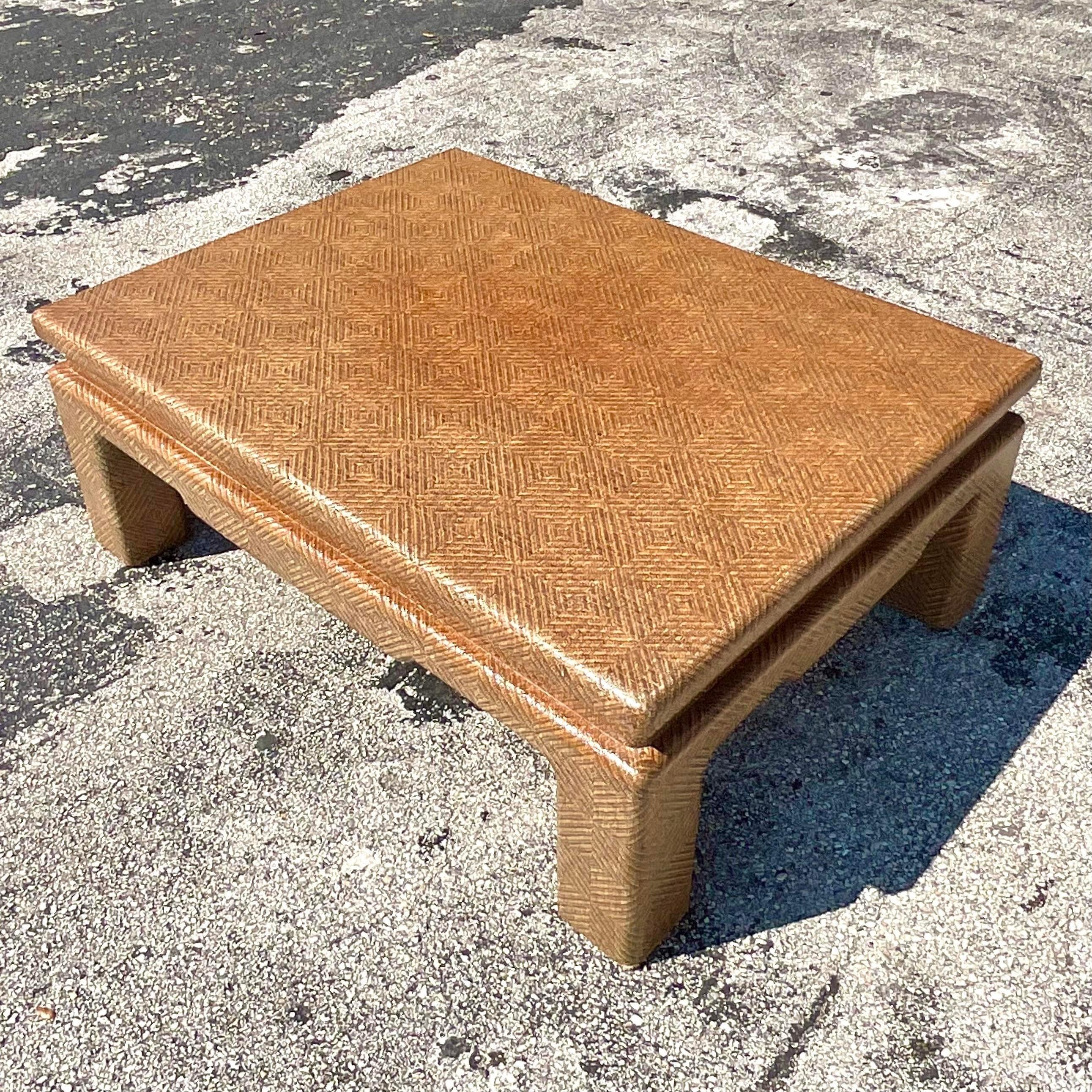 A fabulous vintage Boho coffee table. A chic Grasscloth finish done in the manner of a Harrison Van Horn. Beautiful classic Ming details in a rich brown coloration. Perfect as is or repaint to suit your project. You decide! Acquired from a Palm