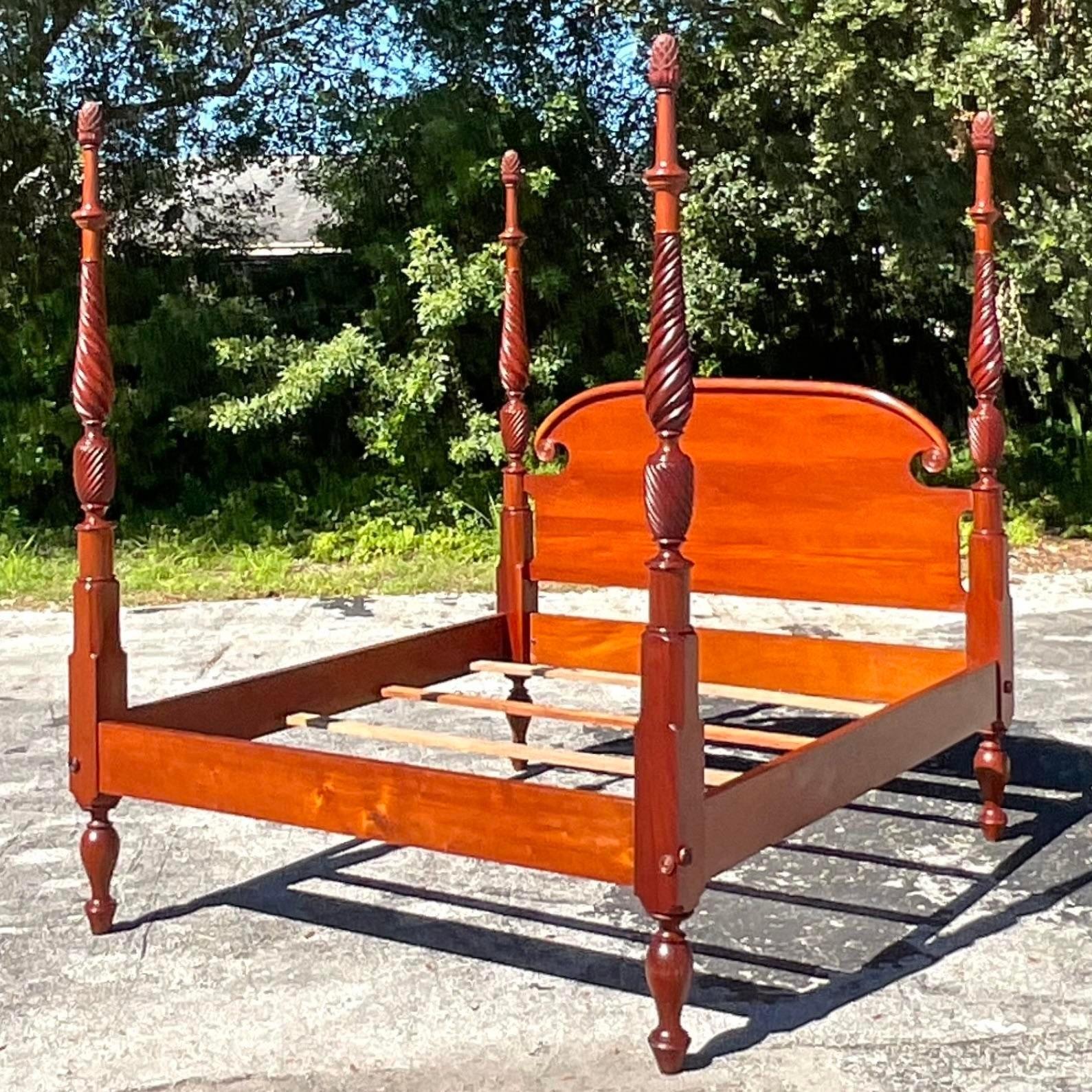 A fantastic vintage Boho King bed. A chic hand carved rice design with beautiful wood grain detail. Interior slat supports. Acquired from a Palm Beach estate.